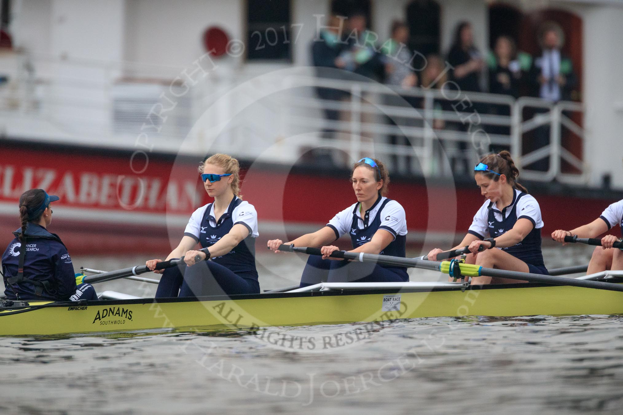 Photo 1803241628571X24462HaraldJoergens The Cancer Research UK Women's Boat Race 2018: The Oxford Blue Boat just before the start of the race - cox Jessica Buck, stroke Beth Bridgman, 7 Abigail Killen, 6 Sara Kushma.
River Thames between Putney Bridge and Mortlake,
London SW15,
United Kingdom,
on 24 March 2018 at 16:28, image #159