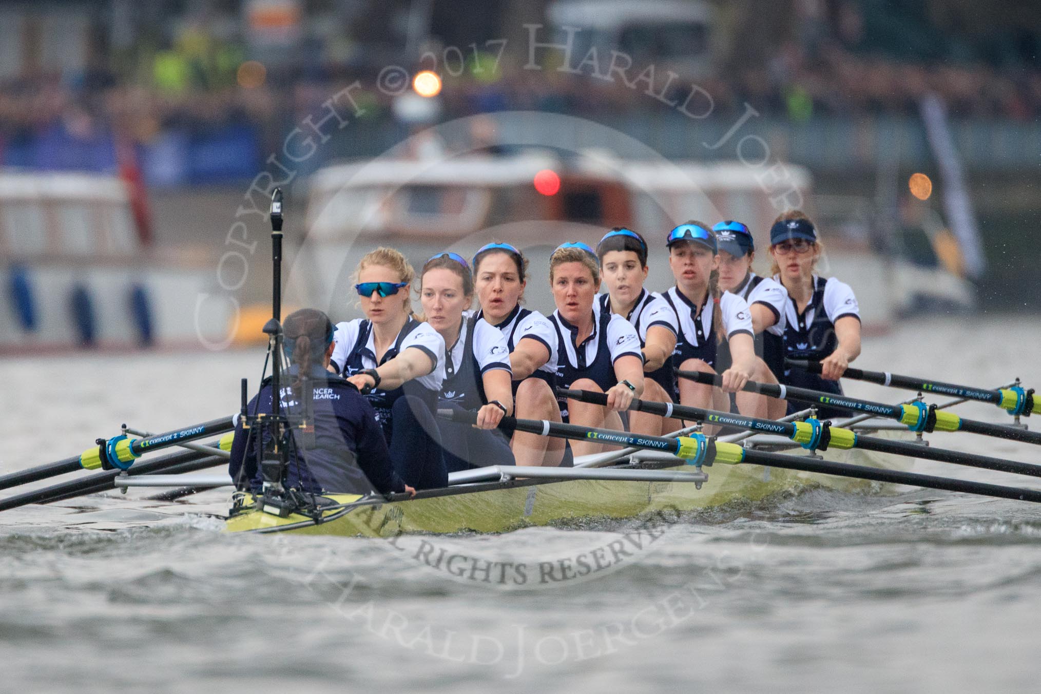 The Cancer Research UK Women's Boat Race 2018: The Oxford Blue Boat between Putney Bridge and the boathouses - cox Jessica Buck, stroke Beth Bridgman, 7 Abigail Killen, 6 Sara Kushma, 5 Morgan McGovern, 4 Alice Roberts, 3 Juliette Perry, 2 Katherine Erickson, bow Renée Koolschijn.
River Thames between Putney Bridge and Mortlake,
London SW15,

United Kingdom,
on 24 March 2018 at 16:31, image #167