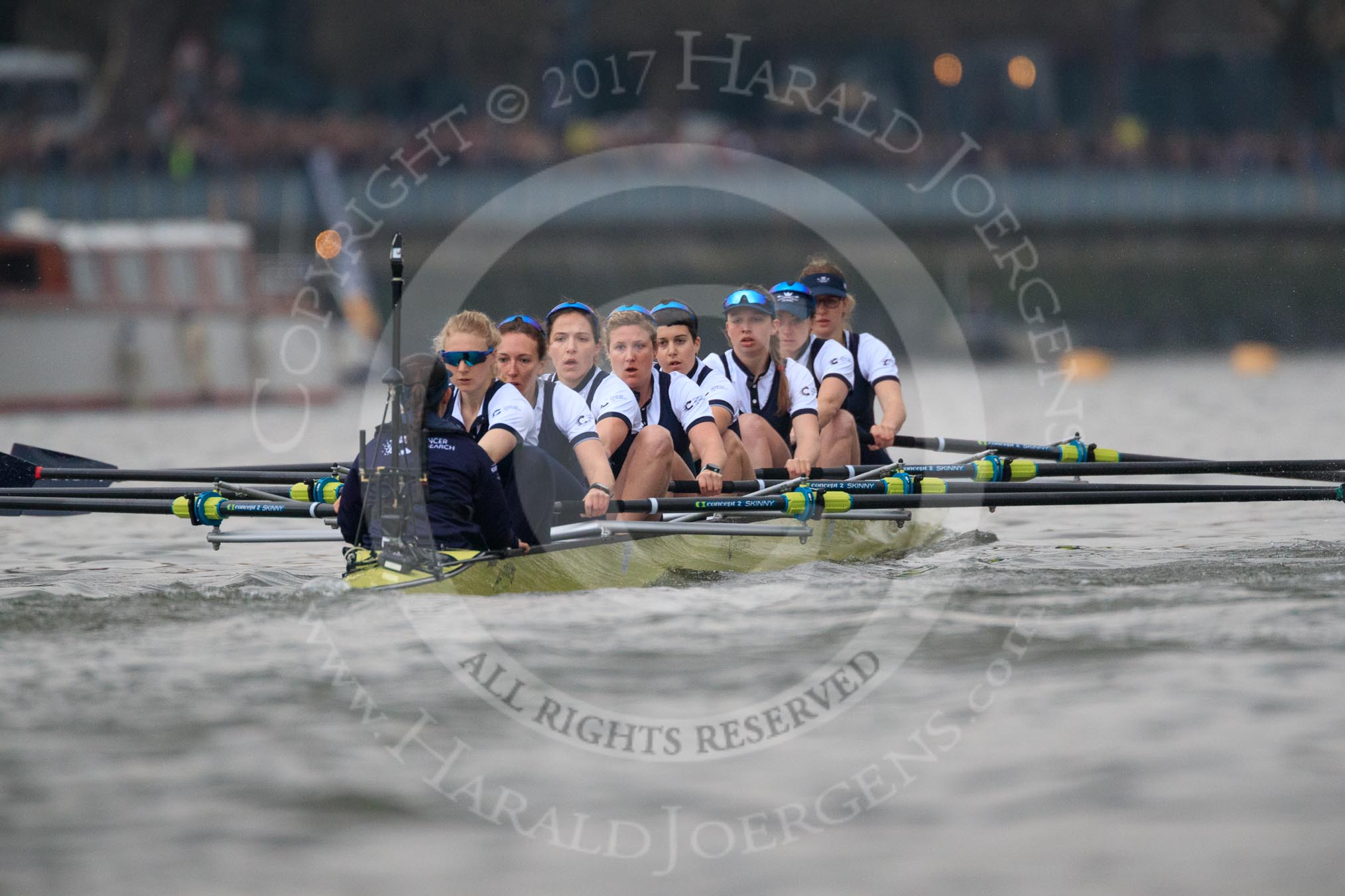 The Cancer Research UK Women's Boat Race 2018: The Oxford Blue Boat between Putney Bridge and the boathouses - cox Jessica Buck, stroke Beth Bridgman, 7 Abigail Killen, 6 Sara Kushma, 5 Morgan McGovern, 4 Alice Roberts, 3 Juliette Perry, 2 Katherine Erickson, bow Renée Koolschijn.
River Thames between Putney Bridge and Mortlake,
London SW15,

United Kingdom,
on 24 March 2018 at 16:31, image #168