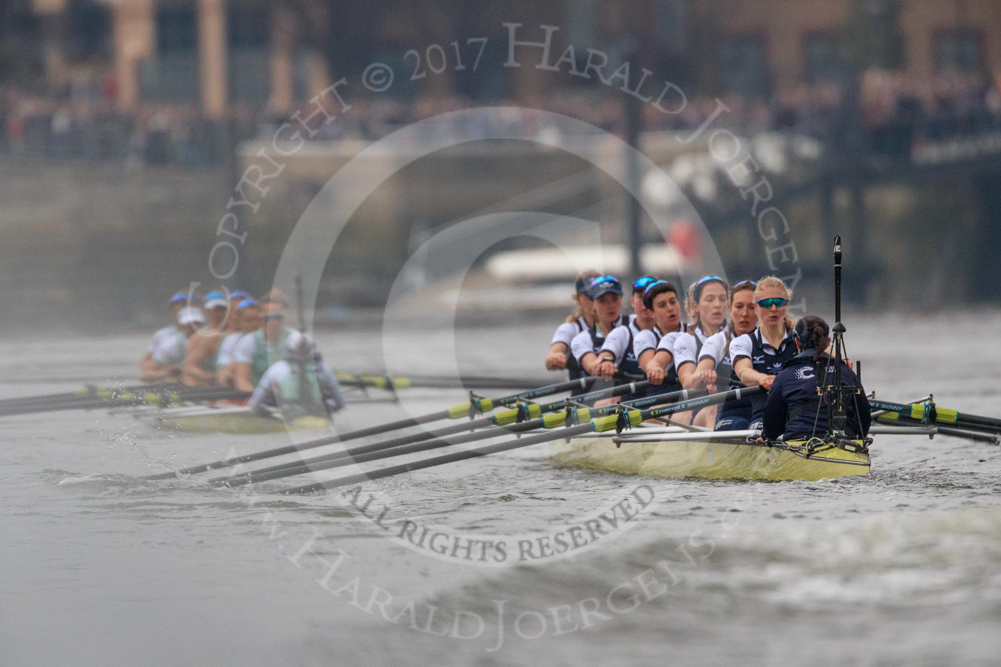 Photo 1803241637101X24615HaraldJoergens The Cancer Research UK Women's Boat Race 2018: Cambridge is getting away - near Harrods Repository, in the Oxford boat bow Renée Koolschijn, 2 Katherine Erickson, 3 Juliette Perry, 4 Alice Roberts, 5 Morgan McGovern, 6 Sara Kushma, 7 Abigail Killen, stroke Beth Bridgman, cox Jessica Buck.
River Thames between Putney Bridge and Mortlake,
London SW15,
United Kingdom,
on 24 March 2018 at 16:37, image #176