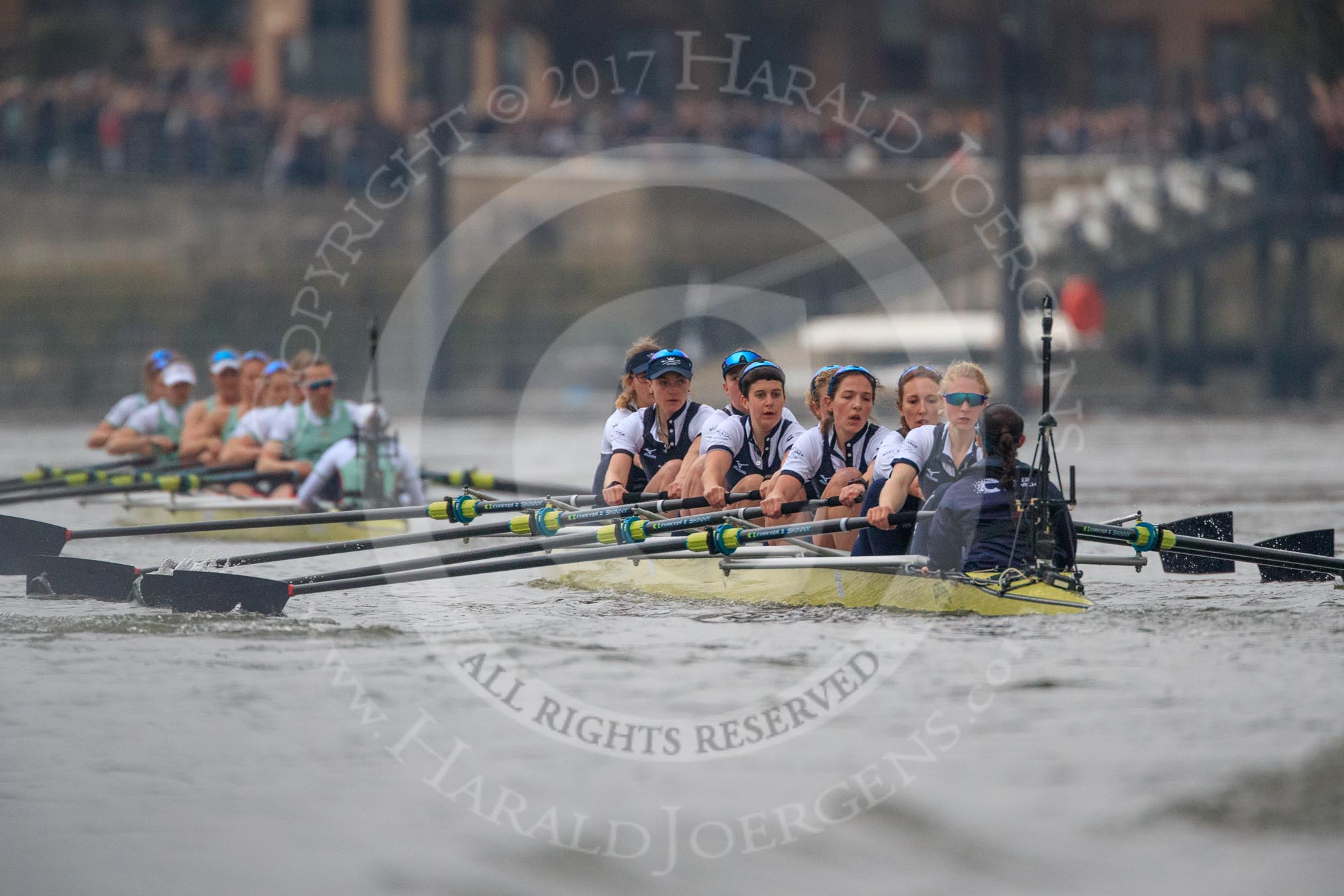 Photo 1803241637171X24635HaraldJoergens The Cancer Research UK Women's Boat Race 2018: Cambridge is getting away - near Harrods Repository, in the Oxford boat bow Renée Koolschijn, 2 Katherine Erickson, 3 Juliette Perry, 4 Alice Roberts, 5 Morgan McGovern, 6 Sara Kushma, 7 Abigail Killen, stroke Beth Bridgman, cox Jessica Buck.
River Thames between Putney Bridge and Mortlake,
London SW15,
United Kingdom,
on 24 March 2018 at 16:37, image #180