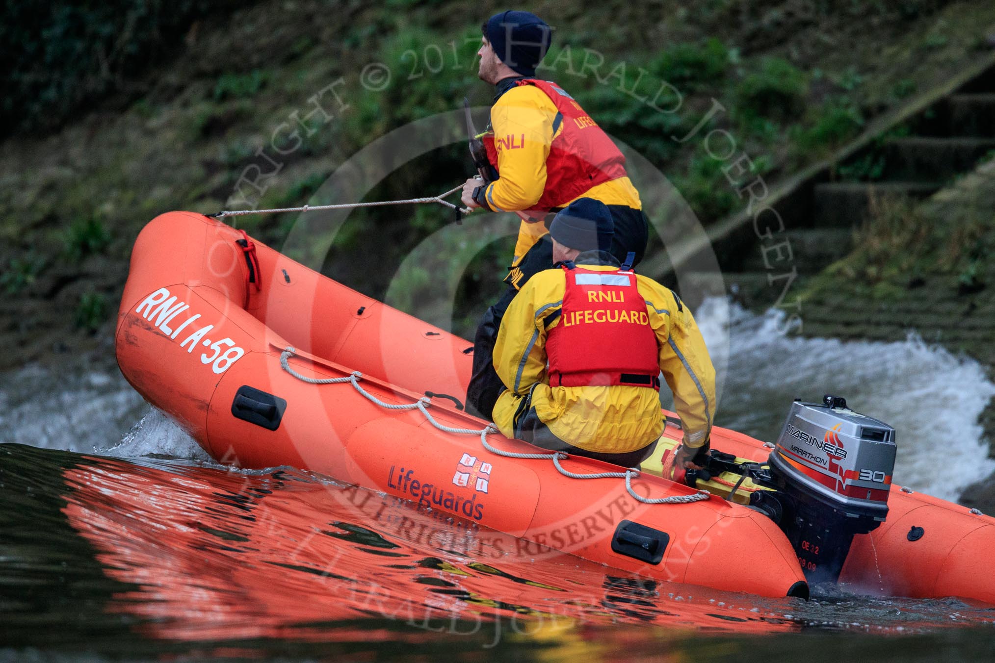 The Cancer Research UK Women's Boat Race 2018: An RNLI lifeboat riding the waves created by the flotilla of boats following the race.
River Thames between Putney Bridge and Mortlake,
London SW15,

United Kingdom,
on 24 March 2018 at 16:41, image #186
