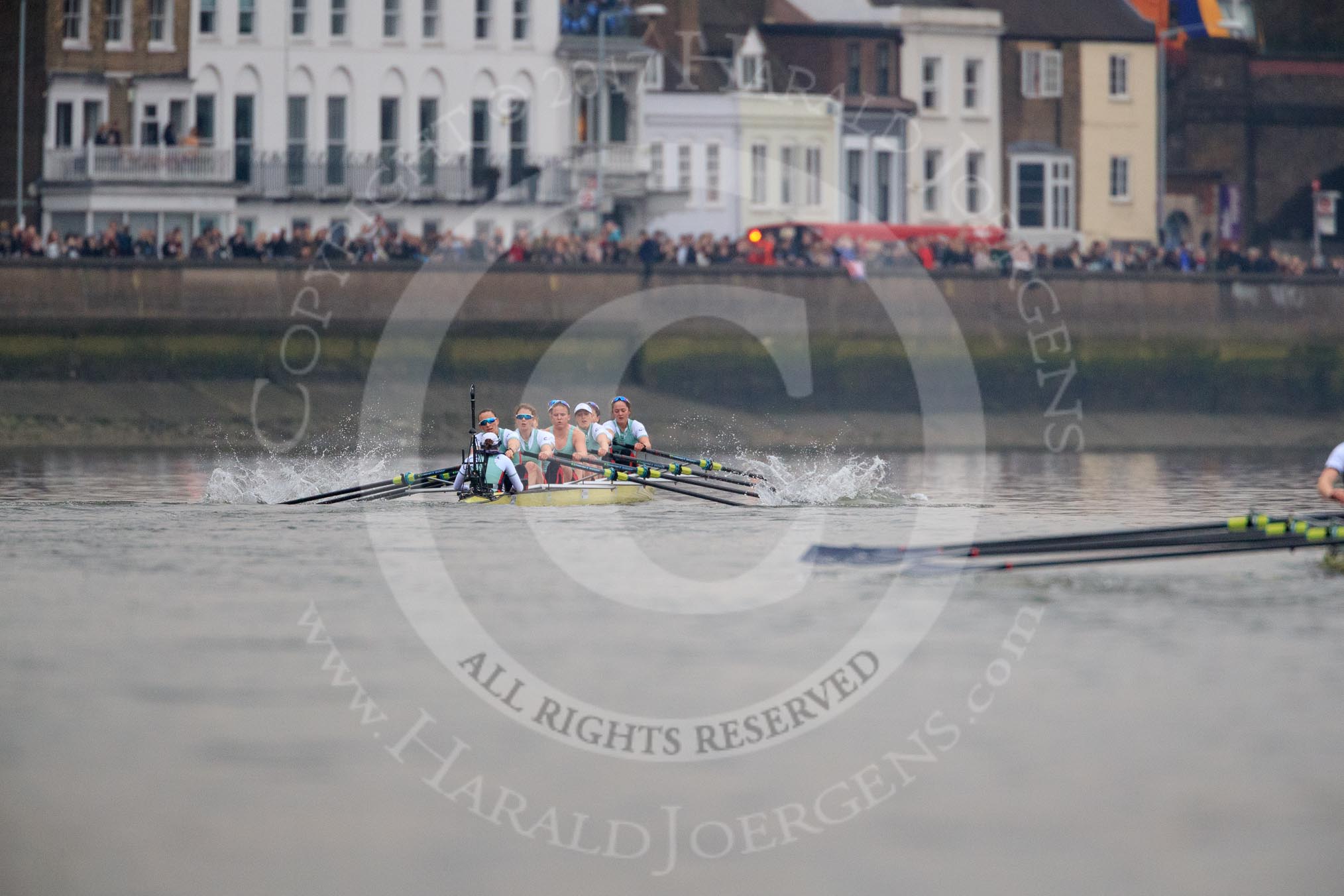 The Cancer Research UK Women's Boat Race 2018: The trailing Oxford boat can just be seen on the right as the Cambridge women extend their lead. Here near the Bandstand, in the Cambridge boat bow Tricia Smith, 2 Imogen Grant, 3 Kelsey Barolak, 4 Thea Zabell, 5 Paula Wesselmann, 6 Alice White, 7 Myriam Goudet-Boukhatmi, stroke Olivia Coffey, cox Sophie Shapter.
River Thames between Putney Bridge and Mortlake,
London SW15,

United Kingdom,
on 24 March 2018 at 16:45, image #191
