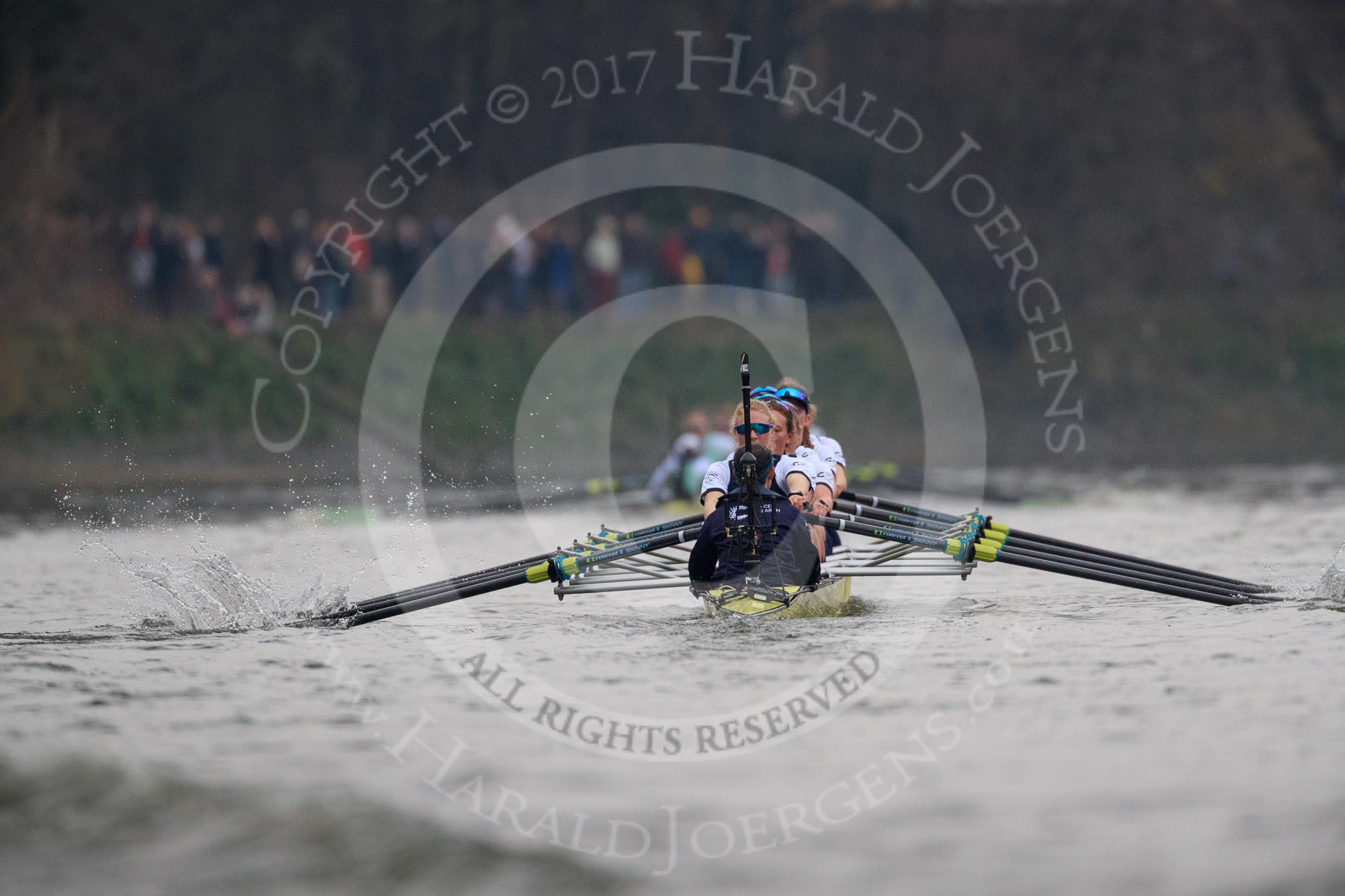 The Cancer Research UK Women's Boat Race 2018: The Oxford boat - cox Jessica Buck, stroke Beth Bridgman, 7 Abigail Killen, 6 Sara Kushma, 5 Morgan McGovern, 4 Alice Roberts, 3 Juliette Perry, 2 Katherine Erickson, bow Renée Koolschijn
. The Cambridge boat is pretty far away in front.
River Thames between Putney Bridge and Mortlake,
London SW15,

United Kingdom,
on 24 March 2018 at 16:48, image #203