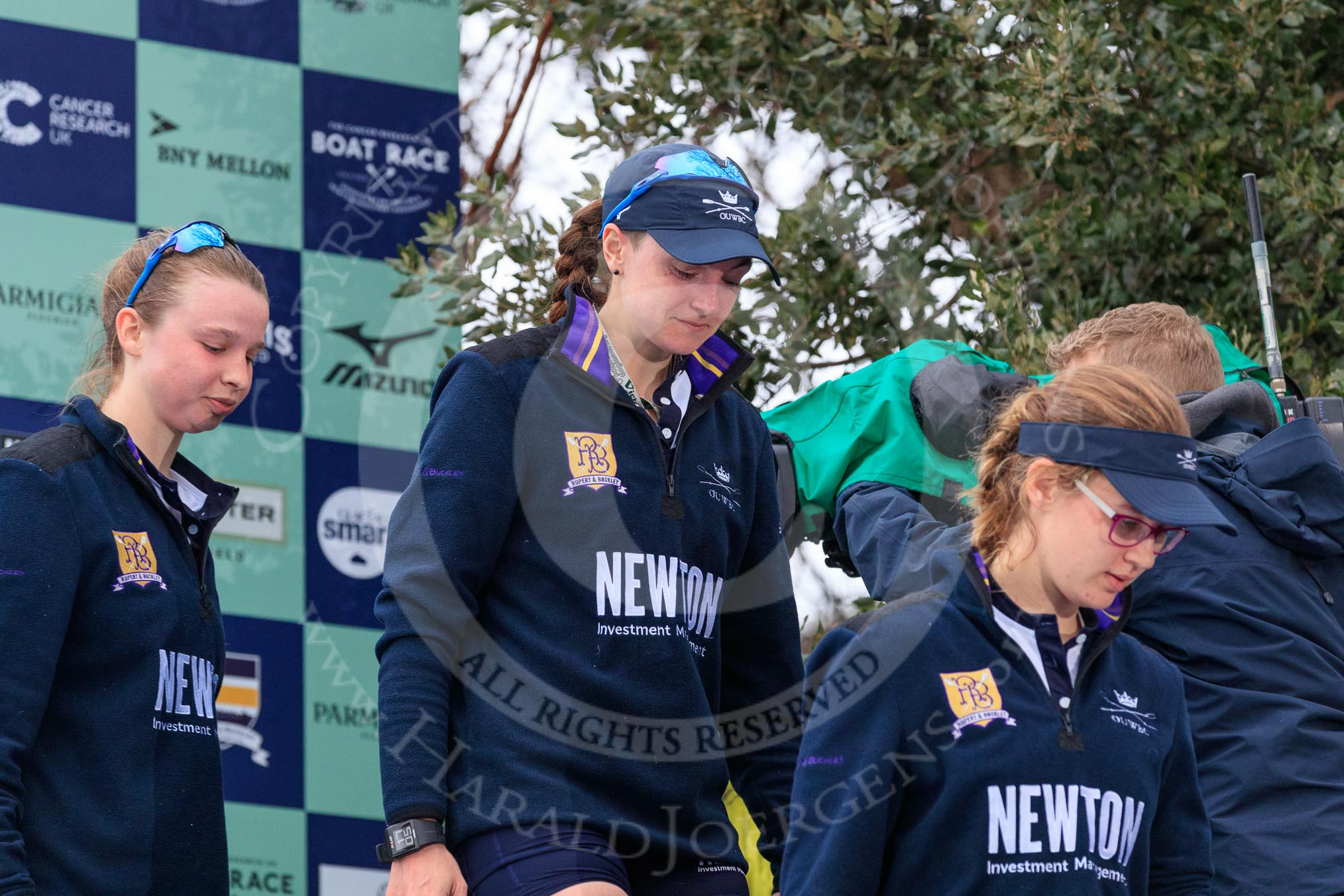 Photo 1803241705461X25211HaraldJoergens The Cancer Research UK Women's Boat Race 2018: Stepping down from the podium after the race - Oxford' s 3 seat Juliette Perry, 2 Katherine Erickson, and bow Renée Koolschijn.
River Thames between Putney Bridge and Mortlake,
London SW15,
United Kingdom,
on 24 March 2018 at 17:05, image #239