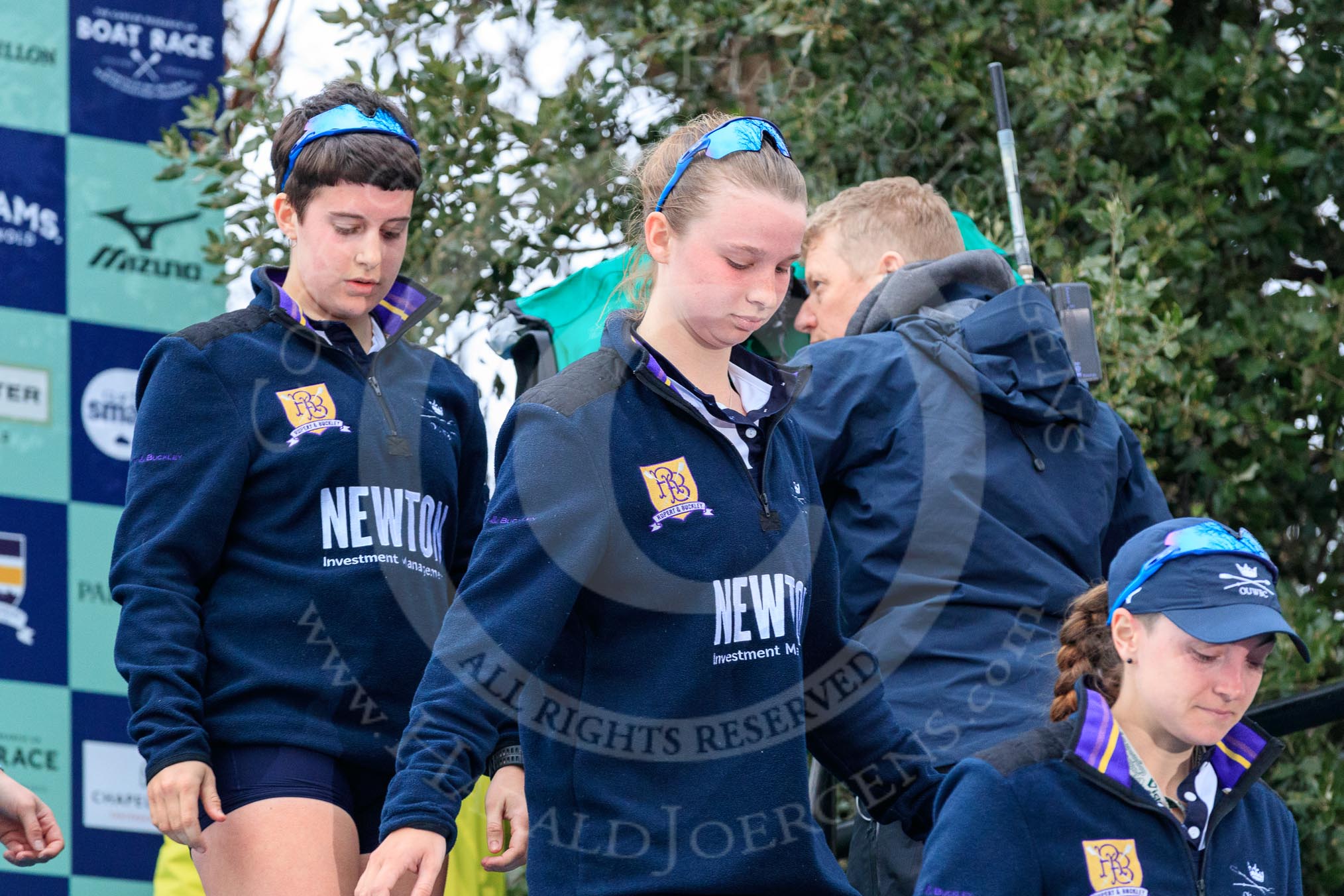 Photo 1803241705491X25223HaraldJoergens The Cancer Research UK Women's Boat Race 2018: Stepping down from the podium after the race - Oxford' s 4 seat Alice Roberts, 3 Juliette Perry, 2 Katherine Erickson.
River Thames between Putney Bridge and Mortlake,
London SW15,
United Kingdom,
on 24 March 2018 at 17:05, image #240