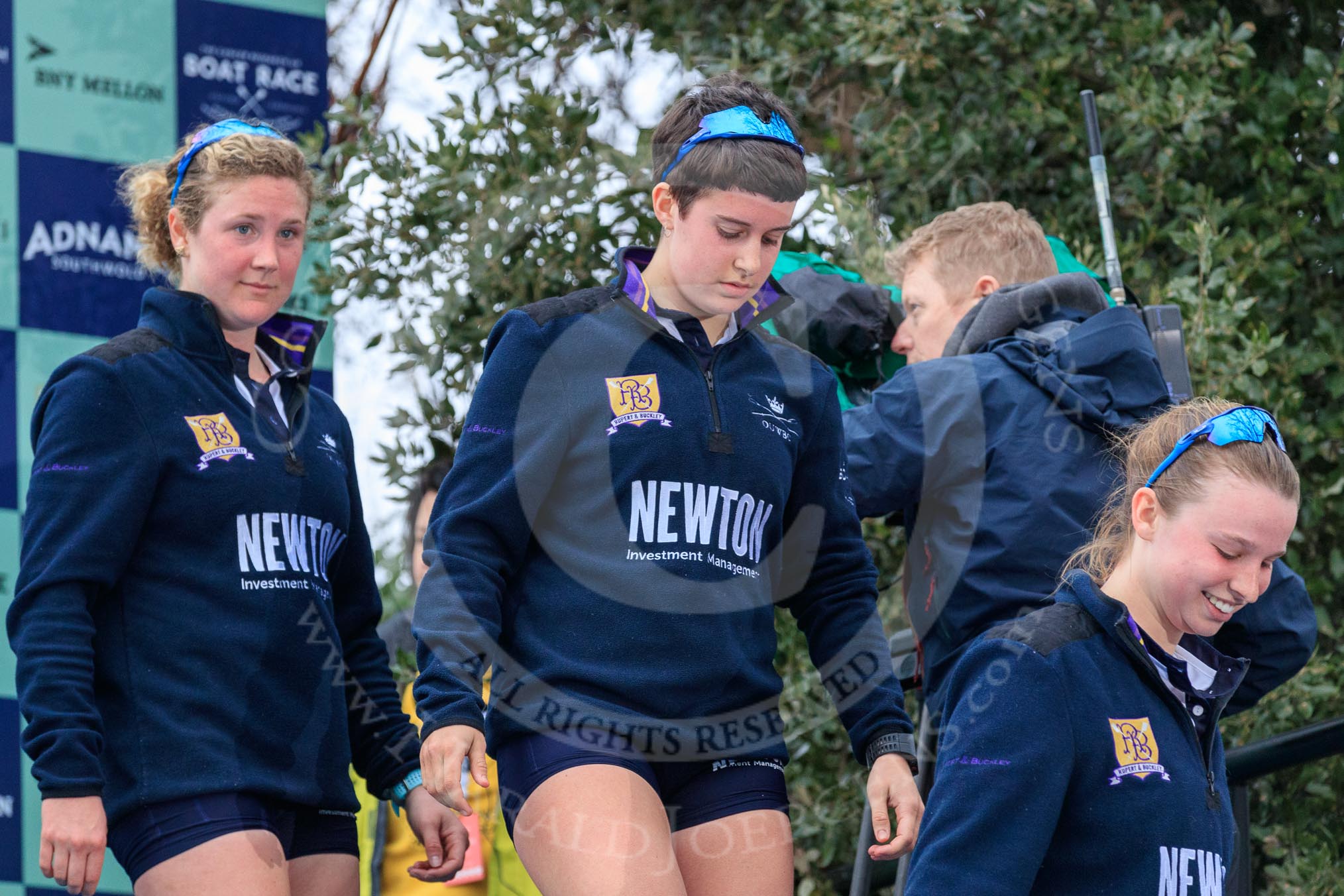The Cancer Research UK Women's Boat Race 2018: Stepping down from the podium after the race - Oxford' s 5 seat Morgan McGovern, 4 Alice Roberts, 3 Juliette Perry.
River Thames between Putney Bridge and Mortlake,
London SW15,

United Kingdom,
on 24 March 2018 at 17:05, image #241