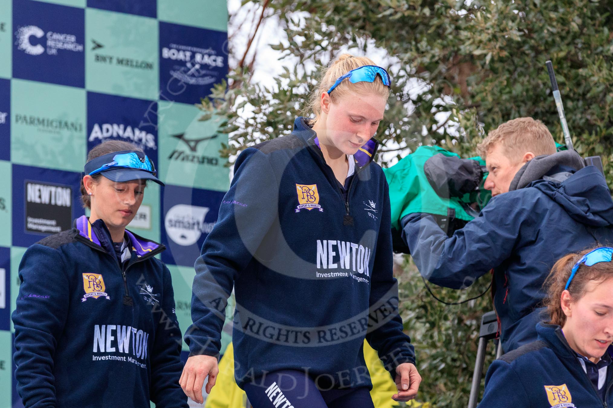 Photo 1803241705581X25252HaraldJoergens The Cancer Research UK Women's Boat Race 2018: Stepping down from the podium after the race - Oxford' s cox Jessica Buck, stroke Beth Bridgman, 7 seat Abigail Killen.
River Thames between Putney Bridge and Mortlake,
London SW15,
United Kingdom,
on 24 March 2018 at 17:05, image #245