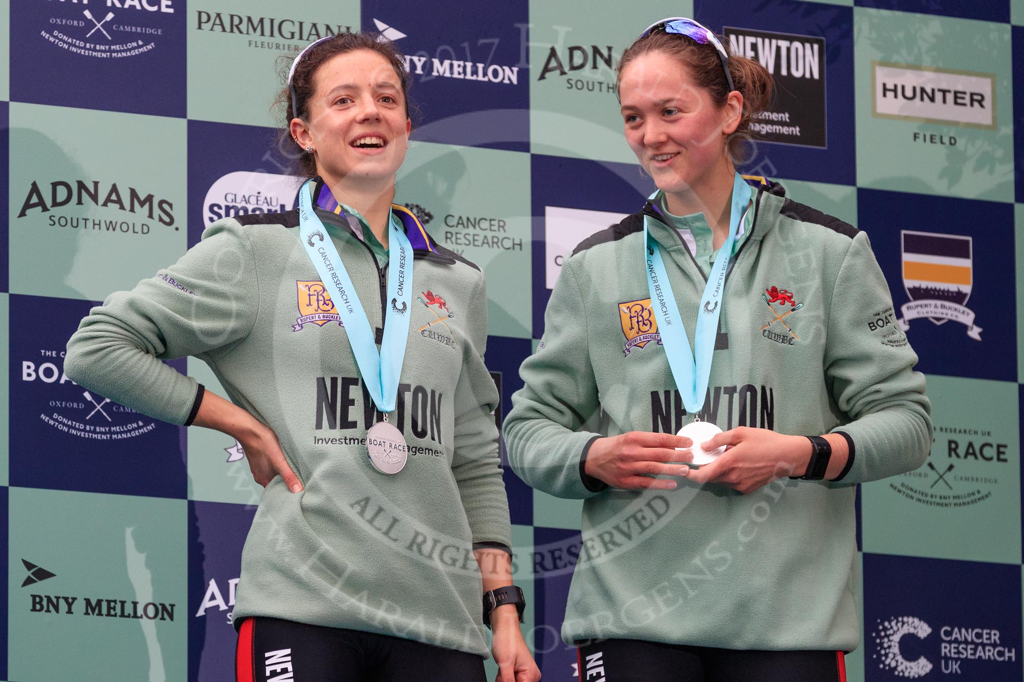The Cancer Research UK Women's Boat Race 2018: Cambridge 2 seat Imogen Grant and bow seat Tricia Smith, with her Women's Boat Race medals. on the podium.
River Thames between Putney Bridge and Mortlake,
London SW15,

United Kingdom,
on 24 March 2018 at 17:06, image #254