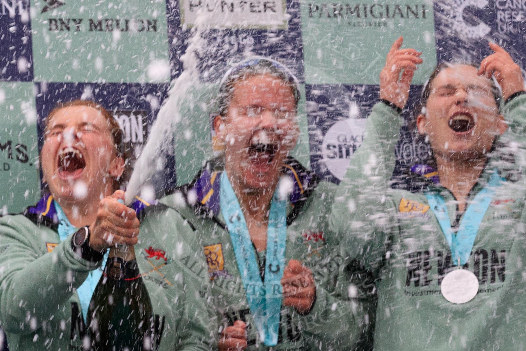 The Cancer Research UK Women's Boat Race 2018: The Cambridge women celebrating with their Boat Race medals, the Women's Boat Race trophy, and lots of Chapel Down Brut. Alice White, Paula Wesselmann, and Myriam Goudet-Boukhatmi  (I guess!).
River Thames between Putney Bridge and Mortlake,
London SW15,

United Kingdom,
on 24 March 2018 at 17:09, image #277