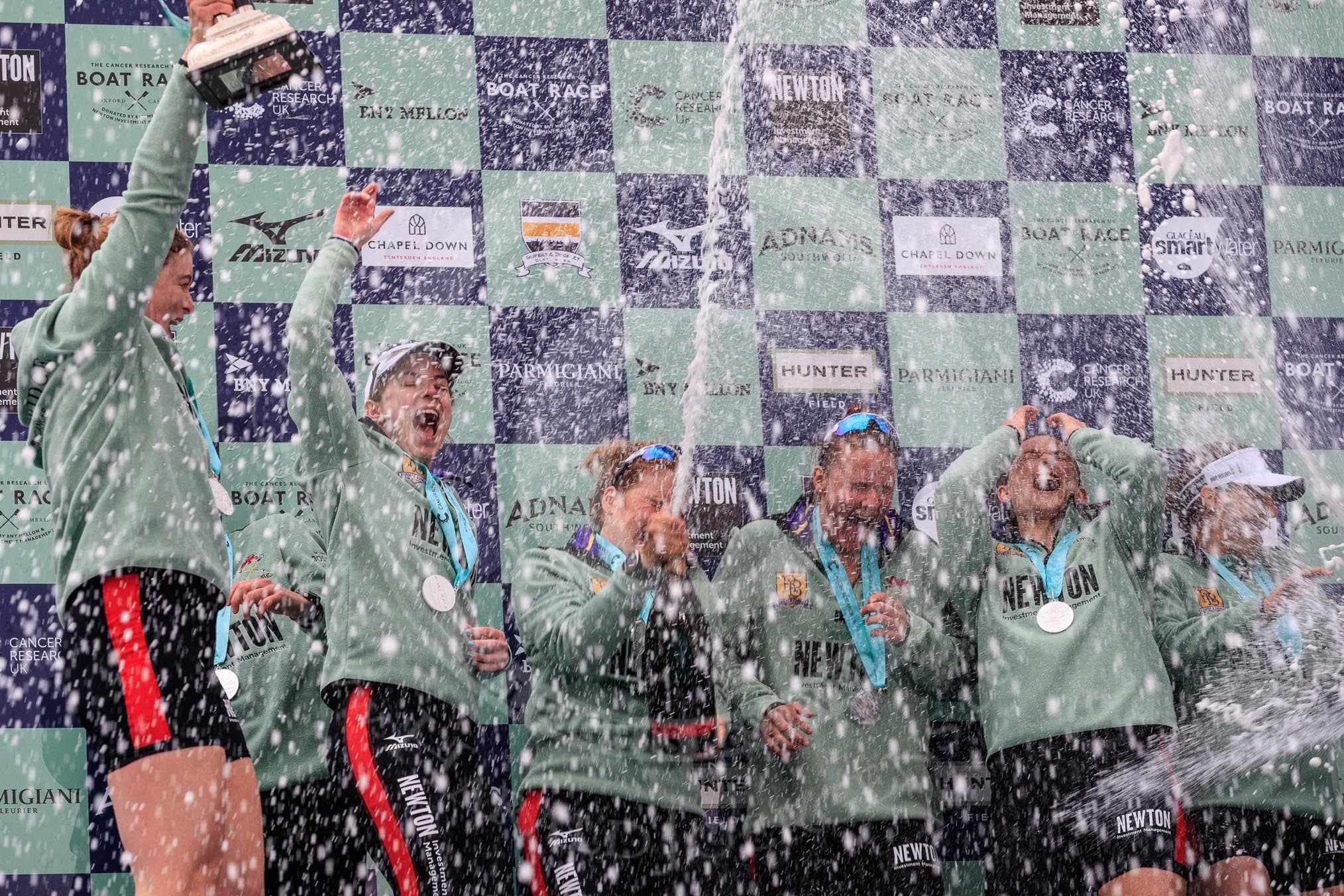 The Cancer Research UK Women's Boat Race 2018: The Cambridge women celebrating with their Boat Race medals, the Women's Boat Race trophy, and lots of Chapel Down Brut..
River Thames between Putney Bridge and Mortlake,
London SW15,

United Kingdom,
on 24 March 2018 at 17:09, image #282