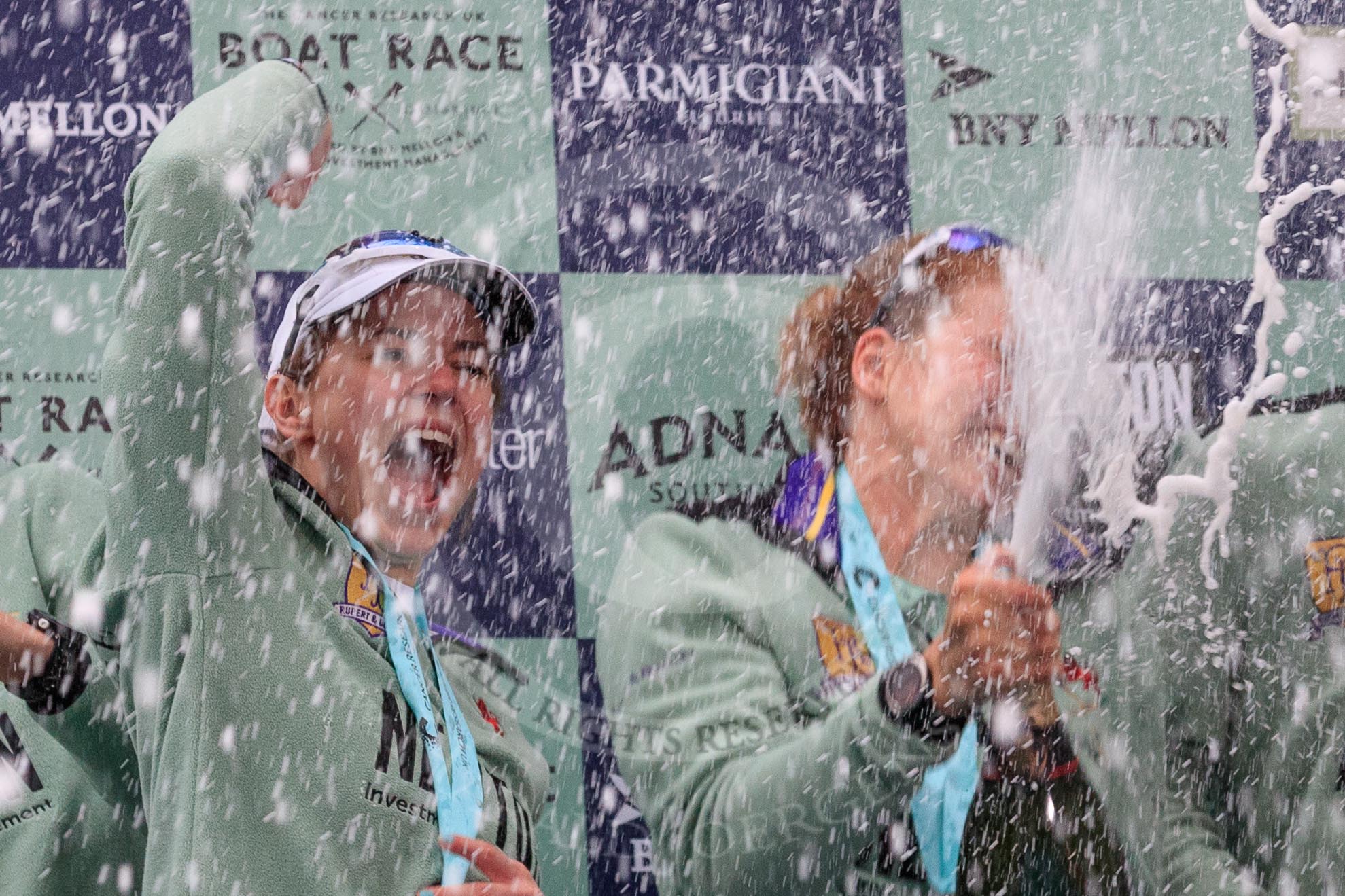The Cancer Research UK Women's Boat Race 2018: The Cambridge women celebrating with their Boat Race medals, the Women's Boat Race trophy, and lots of Chapel Down Brut..
River Thames between Putney Bridge and Mortlake,
London SW15,

United Kingdom,
on 24 March 2018 at 17:09, image #281
