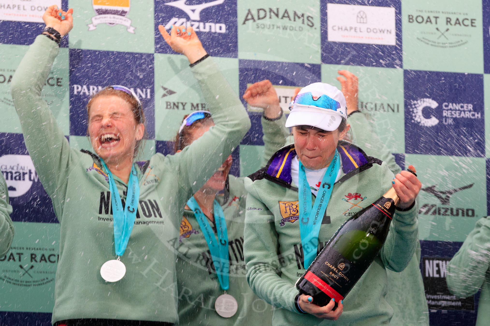 The Cancer Research UK Women's Boat Race 2018: Cambridge victory celebrations and lots of Chapel Down Brut sprayed all over the rowers, here Alice White, Paula Wesselmann, and Sophie Shapter.
River Thames between Putney Bridge and Mortlake,
London SW15,

United Kingdom,
on 24 March 2018 at 17:09, image #285