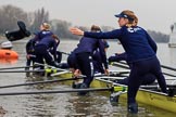 The Cancer Research UK Women's Boat Race 2018: The Oxford Blue Boat crew getting their boat ready for the race, here bow seat Renée Koolschijn throwing one of her wellies to terra firma.
River Thames between Putney Bridge and Mortlake,
London SW15,

United Kingdom,
on 24 March 2018 at 15:44, image #100