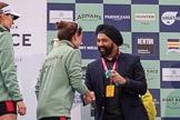 The Cancer Research UK Women's Boat Race 2018: Sir Harpal Kumar, CEO of Cancer Research UK. congratulating Cambridge 2 seat Imogen Grant at the trophy presentation.
River Thames between Putney Bridge and Mortlake,
London SW15,

United Kingdom,
on 24 March 2018 at 17:06, image #251