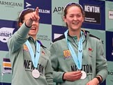 The Cancer Research UK Women's Boat Race 2018: Cambridge 2 seat Imogen Grant and bow seat Tricia Smith, with her Women's Boat Race medals. on the podium.
River Thames between Putney Bridge and Mortlake,
London SW15,

United Kingdom,
on 24 March 2018 at 17:06, image #255