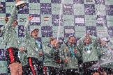 The Cancer Research UK Women's Boat Race 2018: The Cambridge women celebrating with their Boat Race medals, the Women's Boat Race trophy, and lots of Chapel Down Brut..
River Thames between Putney Bridge and Mortlake,
London SW15,

United Kingdom,
on 24 March 2018 at 17:09, image #282