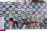 The Cancer Research UK Women's Boat Race 2018: The Cambridge women celebrating with their Boat Race medals, the Women's Boat Race trophy, and lots of Chapel Down Brut. With the trophy Myriam Goudet-Boukhatmi.
River Thames between Putney Bridge and Mortlake,
London SW15,

United Kingdom,
on 24 March 2018 at 17:09, image #283