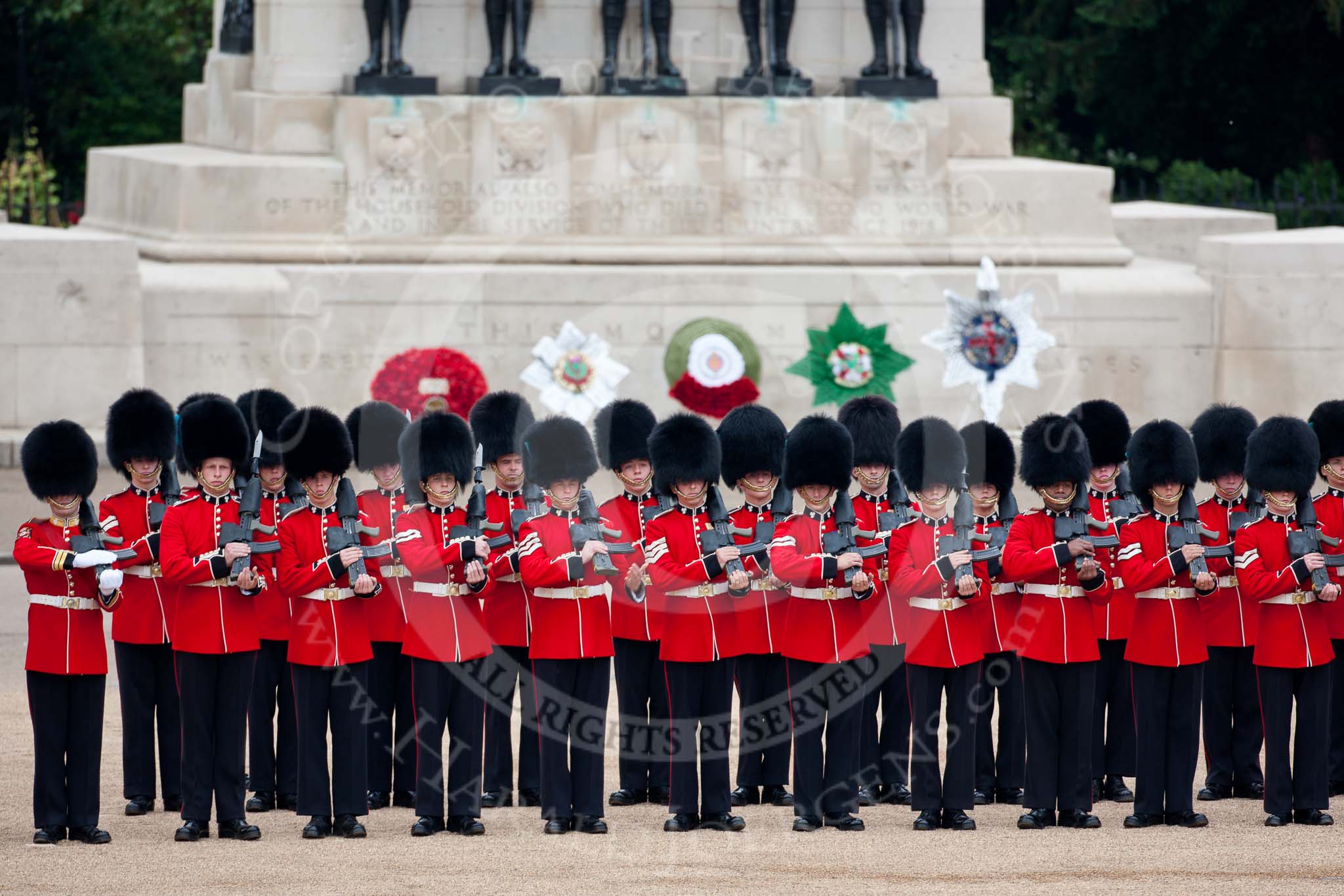 Trooping the Colour 2009: No. 3 Guard, 1st Battalion Irish Guards, presenting arms. Behind them the Guards Memorial..
Horse Guards Parade, Westminster,
London SW1,

United Kingdom,
on 13 June 2009 at 10:42, image #80
