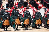 Trooping the Colour 2009: Irish Guards Pipers in their bottle green tunics and saffron coloured kilts with a bottle green cape, in front of Drummers..
Horse Guards Parade, Westminster,
London SW1,

United Kingdom,
on 13 June 2009 at 11:17, image #179