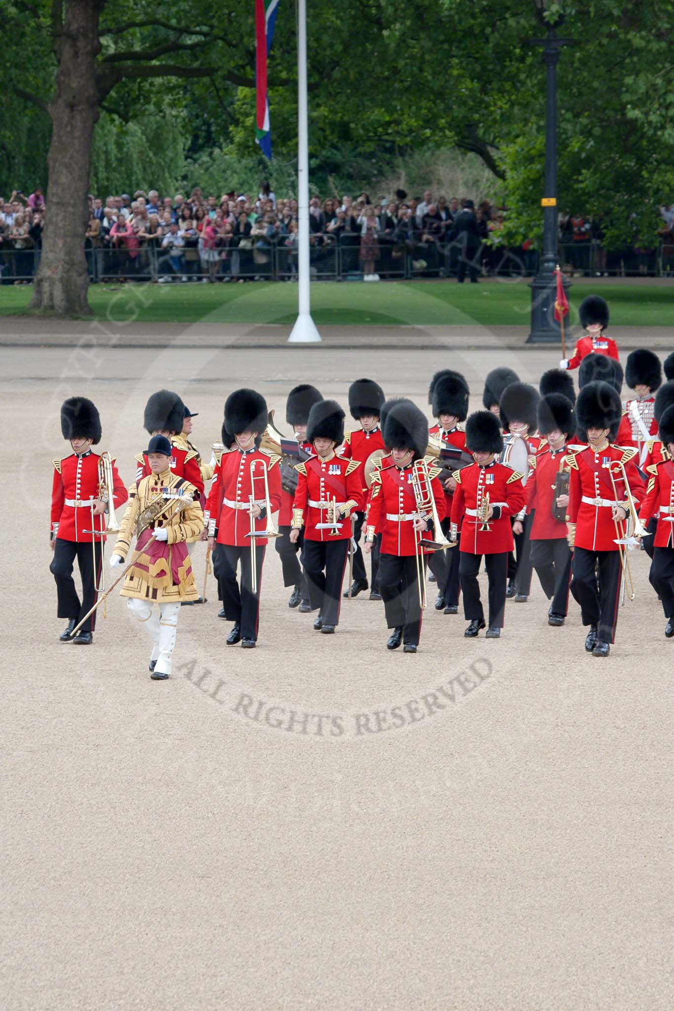 Trooping the Colour 2010: Thirty minutes before the start of the parade. The Band of the Grenadier Guards is led onto the parade ground by their Drum Major.

In the background spectators watching from St. James's Park, on the western side of Horse Guards Parade..
Horse Guards Parade, Westminster,
London SW1,
Greater London,
United Kingdom,
on 12 June 2010 at 10:31, image #15