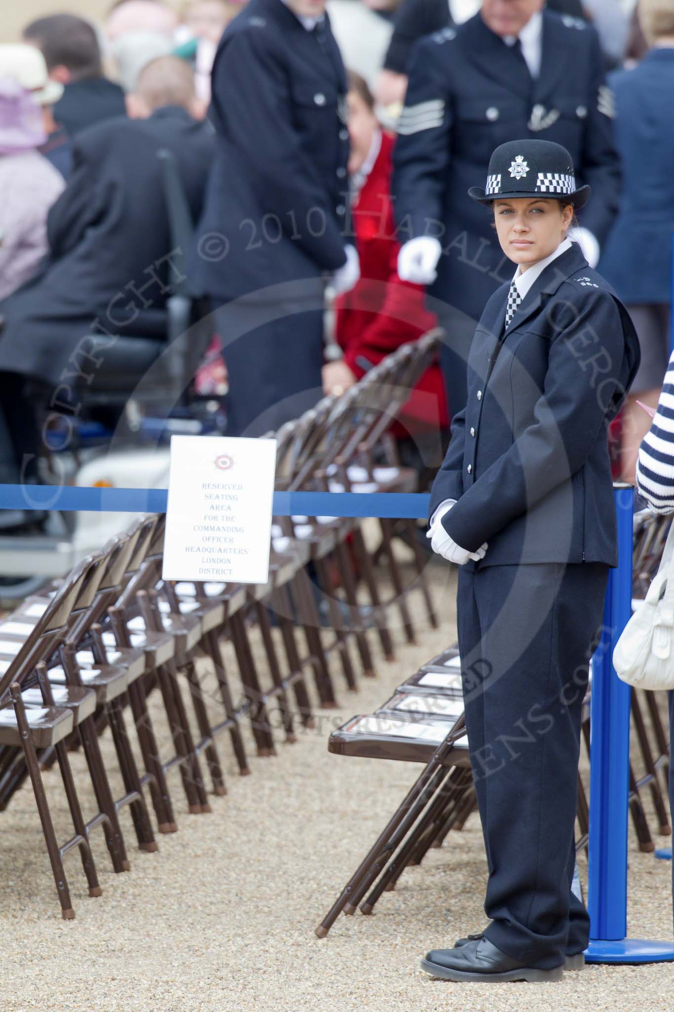 Trooping the Colour 2010: A female Constable of the London Metropolitan Police Service (MPS) is guarding a reserved seating area, the signpost reads 'Reserved Seating Area for the Commanding Officer Headquarters London District'..
Horse Guards Parade, Westminster,
London SW1,
Greater London,
United Kingdom,
on 12 June 2010 at 10:11, image #3