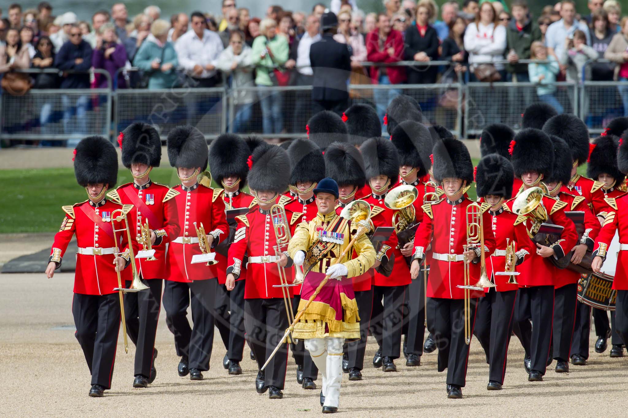 Trooping the Colour 2010: Drum Major Ben Roberts, Coldstream Guards, leading the Band of the Coldstream Guards onto Horse Guards Parade.

In the background specators watching fro, St. James's Park..
Horse Guards Parade, Westminster,
London SW1,
Greater London,
United Kingdom,
on 12 June 2010 at 10:24, image #10
