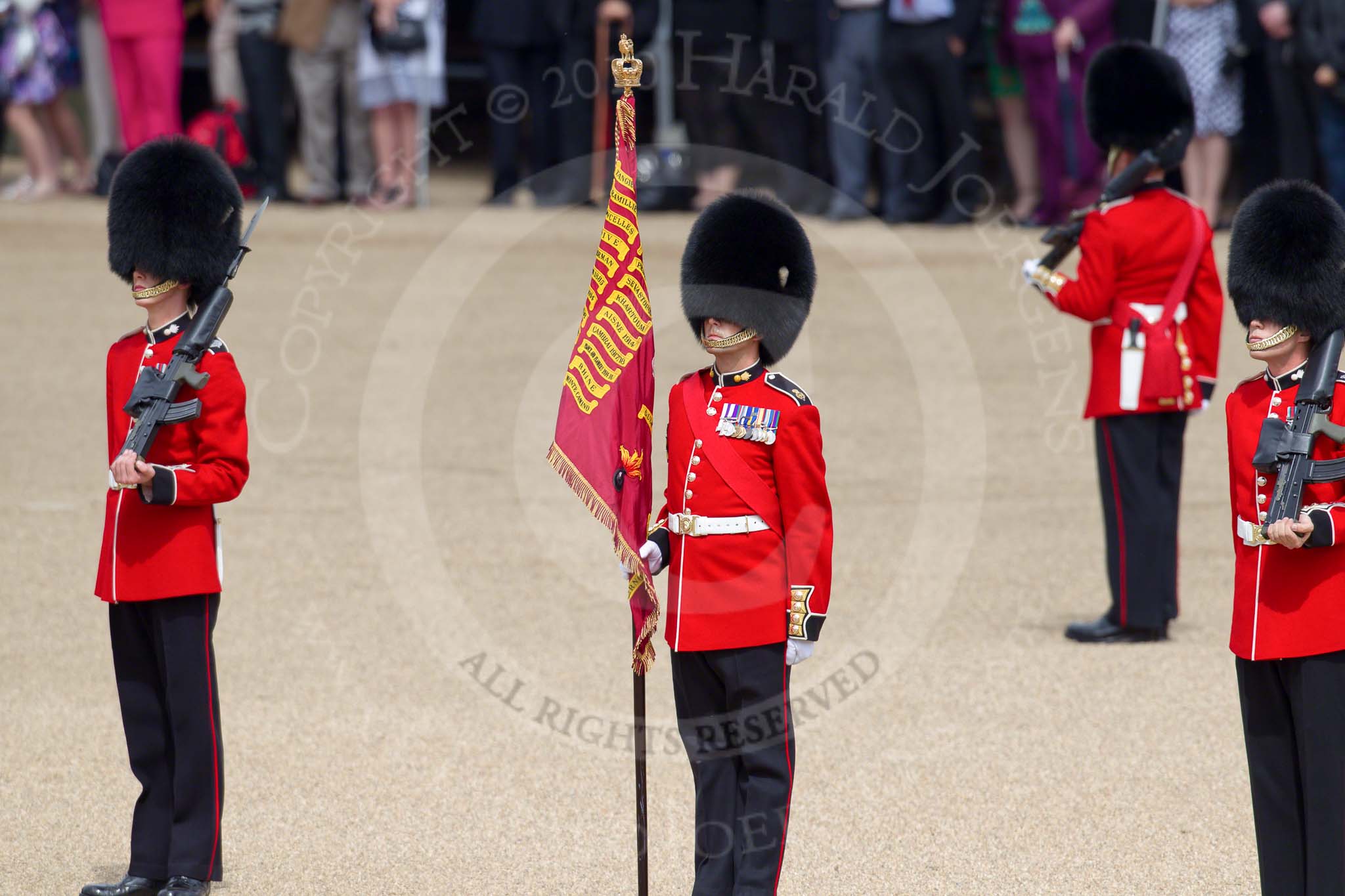 Trooping the Colour 2010: Colour Sergeant Stephen Ross, who was awarded the Military Cross in 2006, with the just uncased Colour.

In the background spectators at the inner line of sentries in front of the Old Admirality Building..
Horse Guards Parade, Westminster,
London SW1,
Greater London,
United Kingdom,
on 12 June 2010 at 10:38, image #23