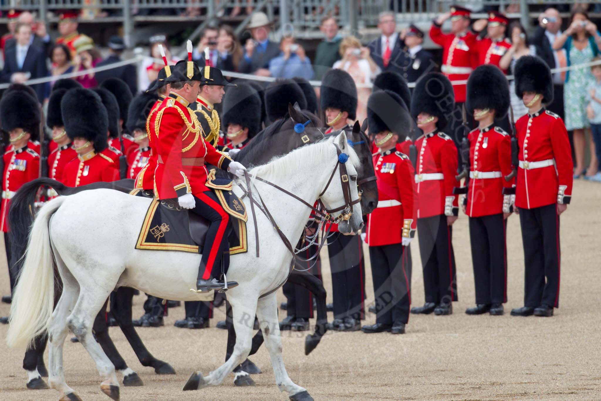Trooping the Colour 2010: The Crown Equerries inspecting the line, here No. 6 Guard, No. 7 Company Coldstream Guards.

In Front Colonel A C Ford, in the middle Lt Col A F Matheson of Matheson, yr, both Equerries in Waiting to Her Majesty, and behind, in black uniform, Major S R Robinson, the Crown Equerry.

In the background spectators on the Inner Line of Sentries and on a stand above in front of the Old Admiralty Building on the eastern side of Horse Guards Parade..
Horse Guards Parade, Westminster,
London SW1,
Greater London,
United Kingdom,
on 12 June 2010 at 11:04, image #86