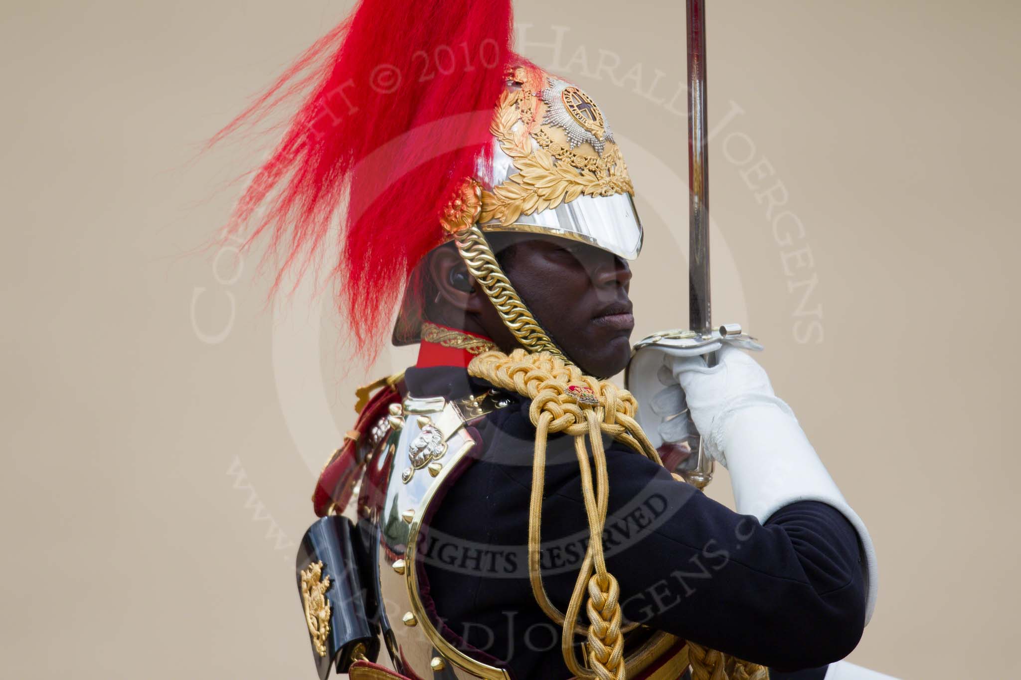 Trooping the Colour 2010: Field Officer of the Escort, Major N K Twumasi Ankrah, The Blues and Royals, during the Ride Past.

Most impressive are the reflections on his shield, especially when seen at full size!.
Horse Guards Parade, Westminster,
London SW1,
Greater London,
United Kingdom,
on 12 June 2010 at 11:56, image #173