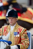Trooping the Colour 2010: For Jack Hargreaves, the head coachman driving the Ivory Mounted Phaeton carrying The Queen and The Prince Philip, 2010 is his fourth parade. He has been 23 years in the army, and 9 years with the Kings Troop.

Behind him visible as very colourful, and very much out of focus, is the Princess Royal on horseback..
Horse Guards Parade, Westminster,
London SW1,
Greater London,
United Kingdom,
on 12 June 2010 at 11:01, image #69