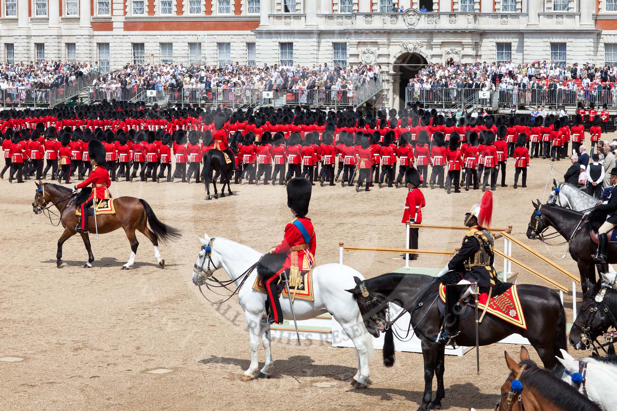 Photo 110604_114620_5D2_4805HaraldJoergens_ The Colonel's Review 2011: The saluting stand, empty, as it is a rehearsal, during the March Past of the Foot Guards. On the left side of the stand, Major Twumasi-Ankrah, Blues and Royals, standing in for the Princess Royal, on his right HRH Prince Edward, the Duke of Kent and Colonel in The Colonel's Review, on the right side of the stand The Queen's Stud Groom, riding in place of the Prince of Wales.
No. 1 to No. 6 Guard are seen during the March Past, on the left is the Field Officer, Lieutenant Colonel L P M Jopp..
Horse Guards Parade, Westminster,
London SW1,
United Kingdom,
on 04 June 2011 at 11:46, image #216