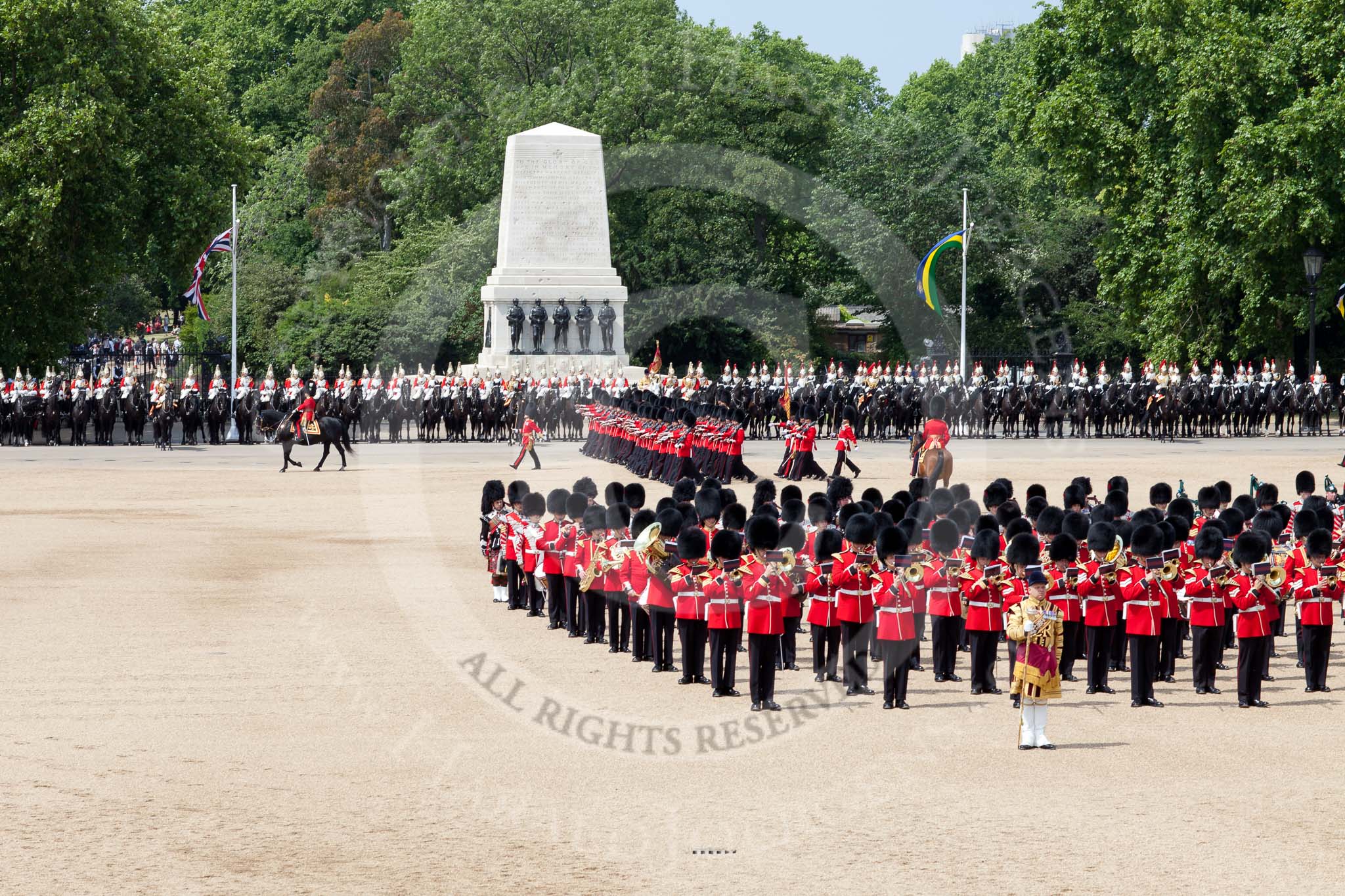 The Colonel's Review 2011: The March Past. In front, in the centre of Horse Guards Parade, the Massed Bands. Behind them, marching, No. 1 Guard, the Escort to the Colour. Behind the Household Cavalry, The Life Guards on the left side, The Blues and Royals on the right. Behind them the Guards Memorial..
Horse Guards Parade, Westminster,
London SW1,

United Kingdom,
on 04 June 2011 at 11:48, image #220