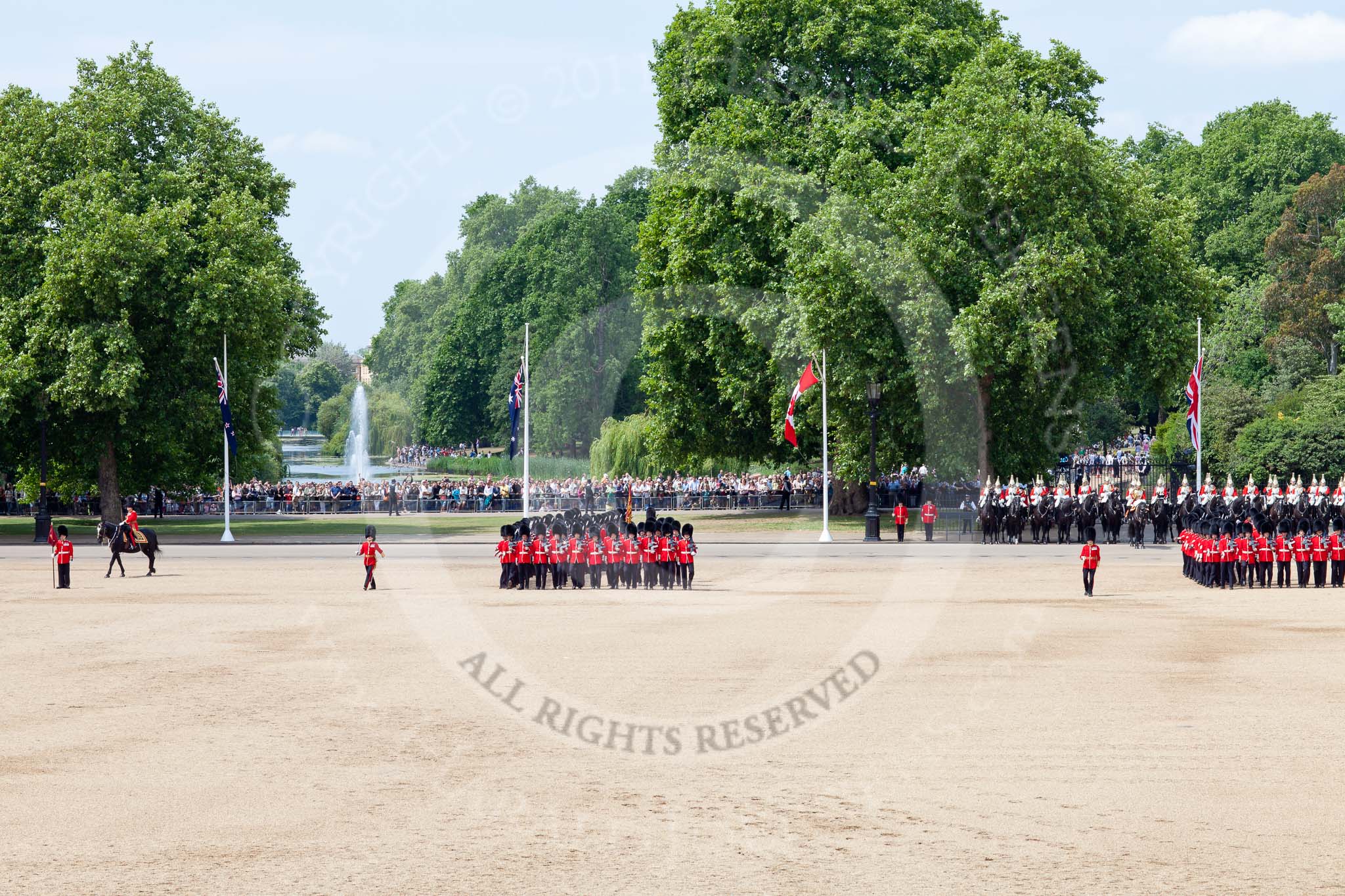 The Colonel's Review 2011: At the end of the March Past, the guards are getting back into their initial position as one long line of guardsman. In the background, spectators watching from St. James's Parl, with the lake and water feature..
Horse Guards Parade, Westminster,
London SW1,

United Kingdom,
on 04 June 2011 at 11:49, image #221