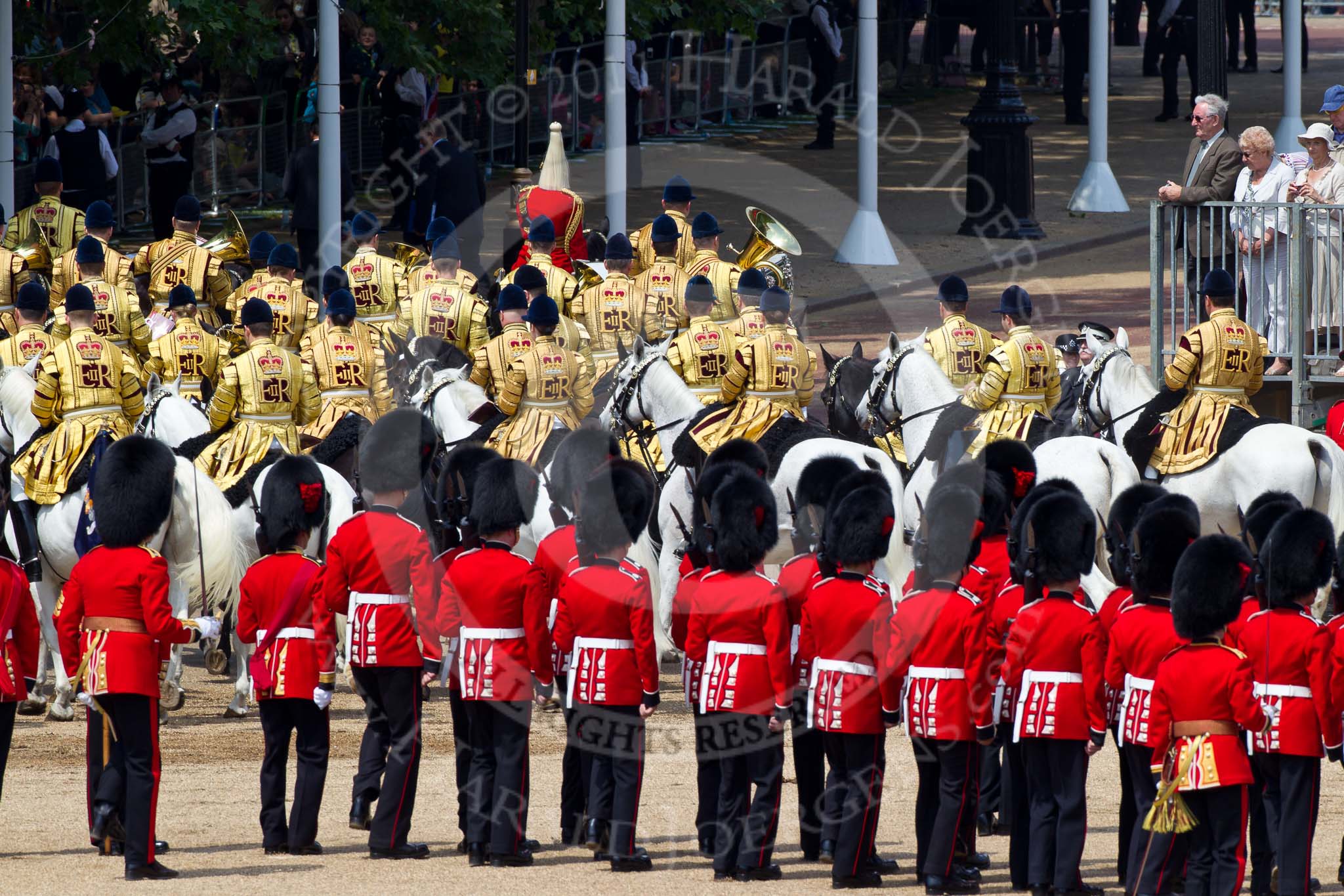 The Colonel's Review 2011: The Massed Bands of the Household Cavalry marching off, leaving Horse Guards Parade towards The Mall, at the end of the rehearsal. Leading them, in red, Director of Music Major K L Davies..
Horse Guards Parade, Westminster,
London SW1,

United Kingdom,
on 04 June 2011 at 12:01, image #275