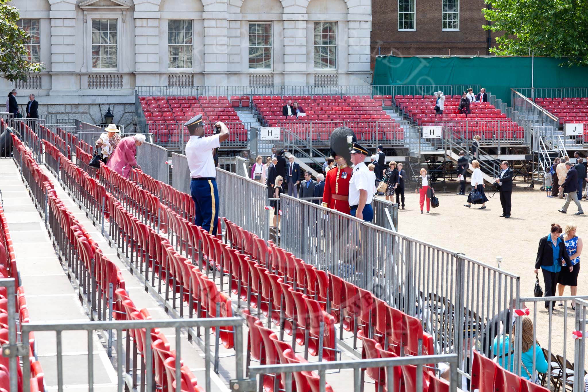 The Colonel's Review 2011: The Colonel's Review is over - visitors posing with guardsmen for a photo..
Horse Guards Parade, Westminster,
London SW1,

United Kingdom,
on 04 June 2011 at 12:20, image #313