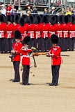 The Colonel's Review 2011: Uncasing the Colour. Colour Sergeant Chris Millin is holding the flag, whilst the Duty Drummer removes the colour case. Behind the drummer, presenting arms, one of the two sentries..
Horse Guards Parade, Westminster,
London SW1,

United Kingdom,
on 04 June 2011 at 10:33, image #44