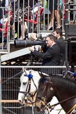 The Colonel's Review 2011: Photographers at work during the March Past, with the spectators on the grand stand behind standing as the Colour passes in front of them..
Horse Guards Parade, Westminster,
London SW1,

United Kingdom,
on 04 June 2011 at 12:08, image #295