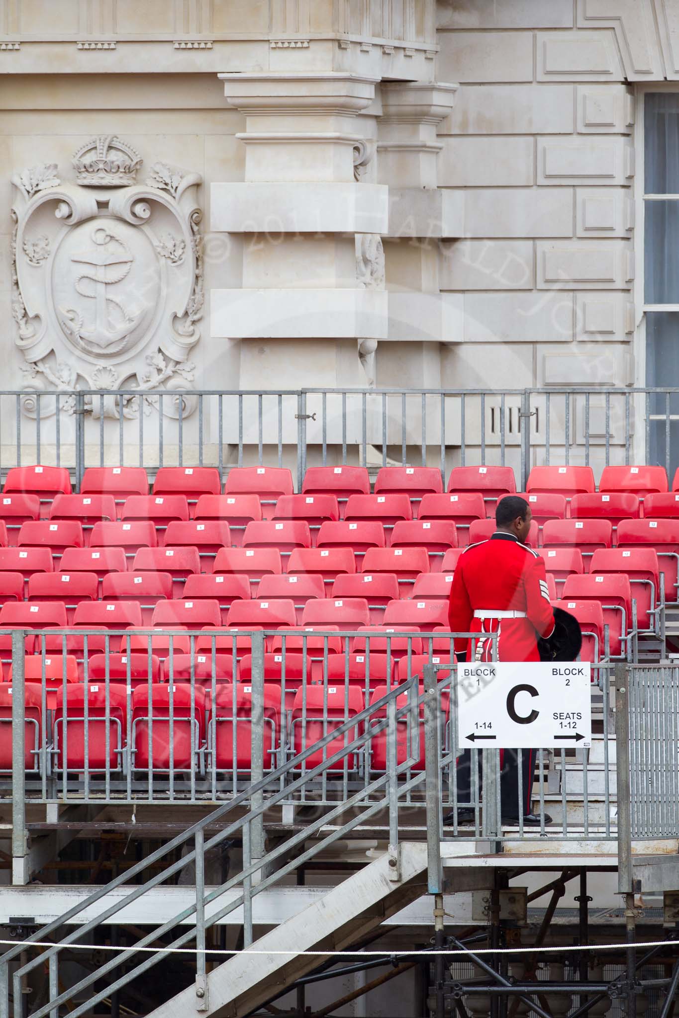 The Major General's Review 2011: Checking the grand stand on the Old Admirality Buildings side of Horse Guards Parade, early in the morning, a Sergeant of the Welsh Guards..
Horse Guards Parade, Westminster,
London SW1,
Greater London,
United Kingdom,
on 28 May 2011 at 09:03, image #5