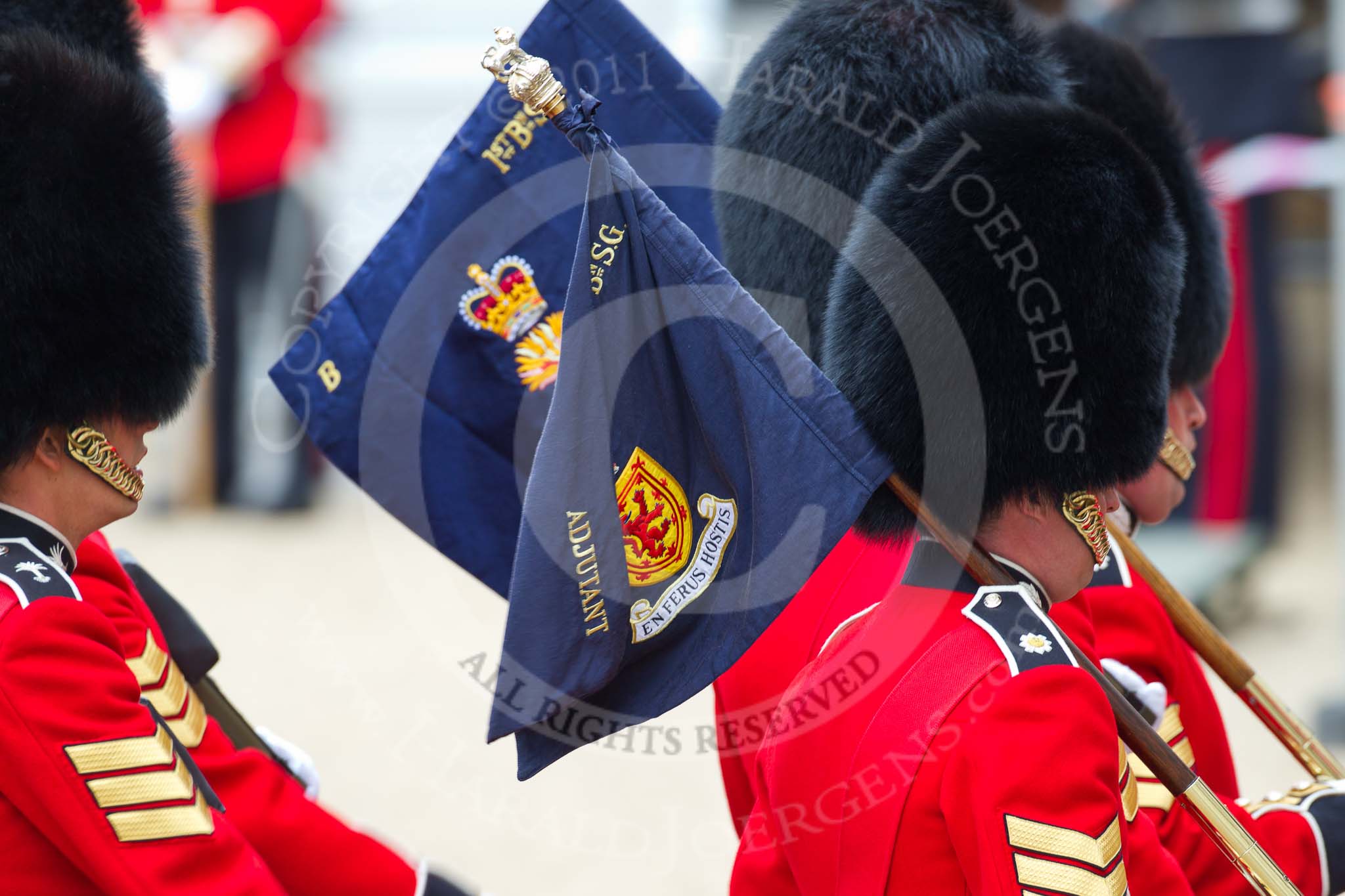 The Major General's Review 2011: The 'Keepers of the Ground', guardsmen of the participating guards divisions, marching towards their position on the parade ground. The flag of the 1st Battalion Scots Guards says 'En Ferus Hostis' - 'Behold A Fierce Enemy'..
Horse Guards Parade, Westminster,
London SW1,
Greater London,
United Kingdom,
on 28 May 2011 at 09:43, image #9