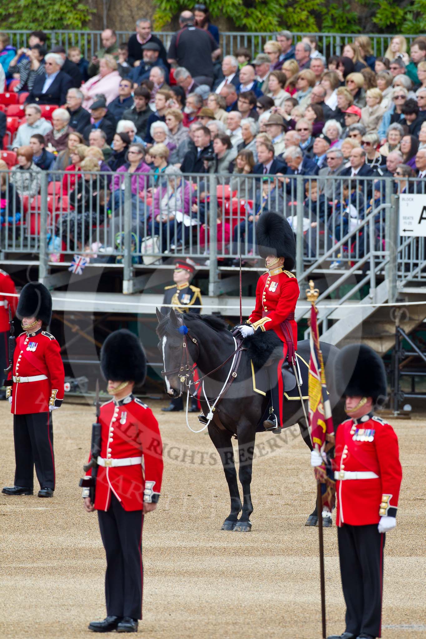 The Major General's Review 2011: On the right Colour Sergeant Chris Millin, holding the Colour. To his right a sentry, behind them, on horseback, the Adjutant of the Parade, Captain Hamish Barne, 1st Battalion Scots Guards..
Horse Guards Parade, Westminster,
London SW1,
Greater London,
United Kingdom,
on 28 May 2011 at 10:44, image #78
