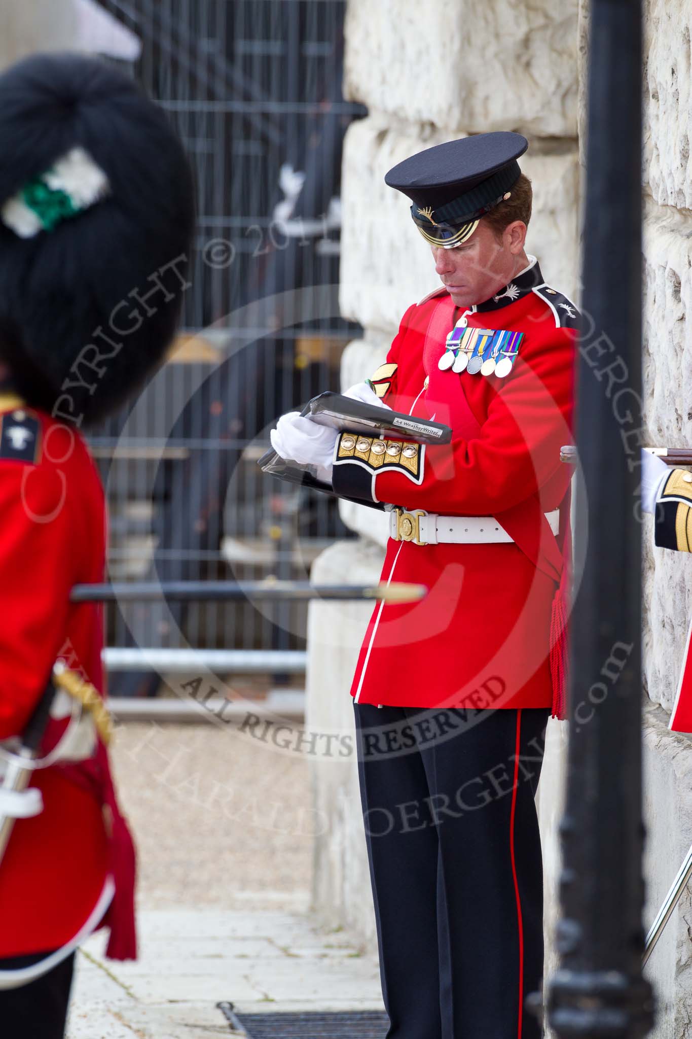 The Major General's Review 2011: Colour Sergeant of the Welsh Guards taking notes during the rehearsal..
Horse Guards Parade, Westminster,
London SW1,
Greater London,
United Kingdom,
on 28 May 2011 at 10:45, image #79