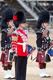 The Major General's Review 2011: A Colour Sergeant from the Band of the Irish Guards, behind him two pipers from the Irish Guards..
Horse Guards Parade, Westminster,
London SW1,
Greater London,
United Kingdom,
on 28 May 2011 at 12:00, image #264
