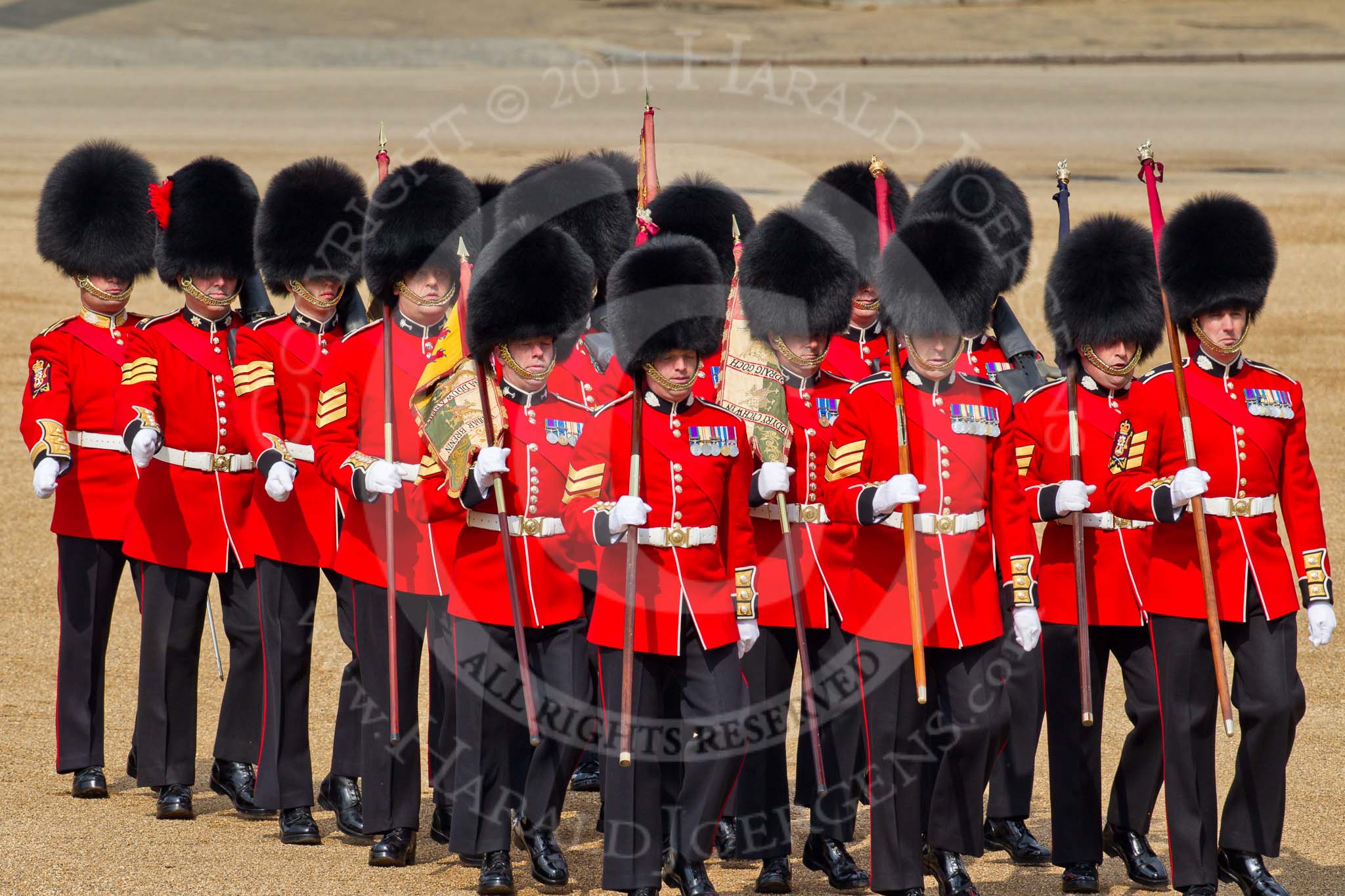 Trooping the Colour 2011: 'Keepers of the Ground' marching towards Horse Guards Arch, in the run-up of the parade.
The Guardsmen are bearing marker flags, which will be used to mark the positions of No. 1 to No. 6 Guards on the parade ground..
Horse Guards Parade, Westminster,
London SW1,
Greater London,
United Kingdom,
on 11 June 2011 at 09:45, image #4