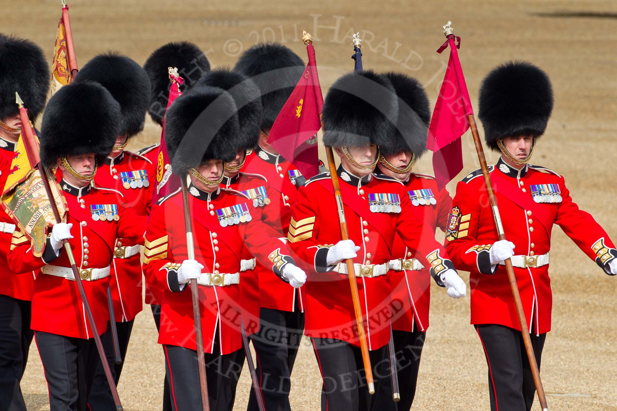 Trooping the Colour 2011: 'Keepers of the Ground' marching towards Horse Guards Arch, in the run-up of the parade.
The Guardsmen are bearing marker flags, which will be used to mark the positions of No. 1 to No. 6 Guards on the parade ground..
Horse Guards Parade, Westminster,
London SW1,
Greater London,
United Kingdom,
on 11 June 2011 at 09:46, image #5