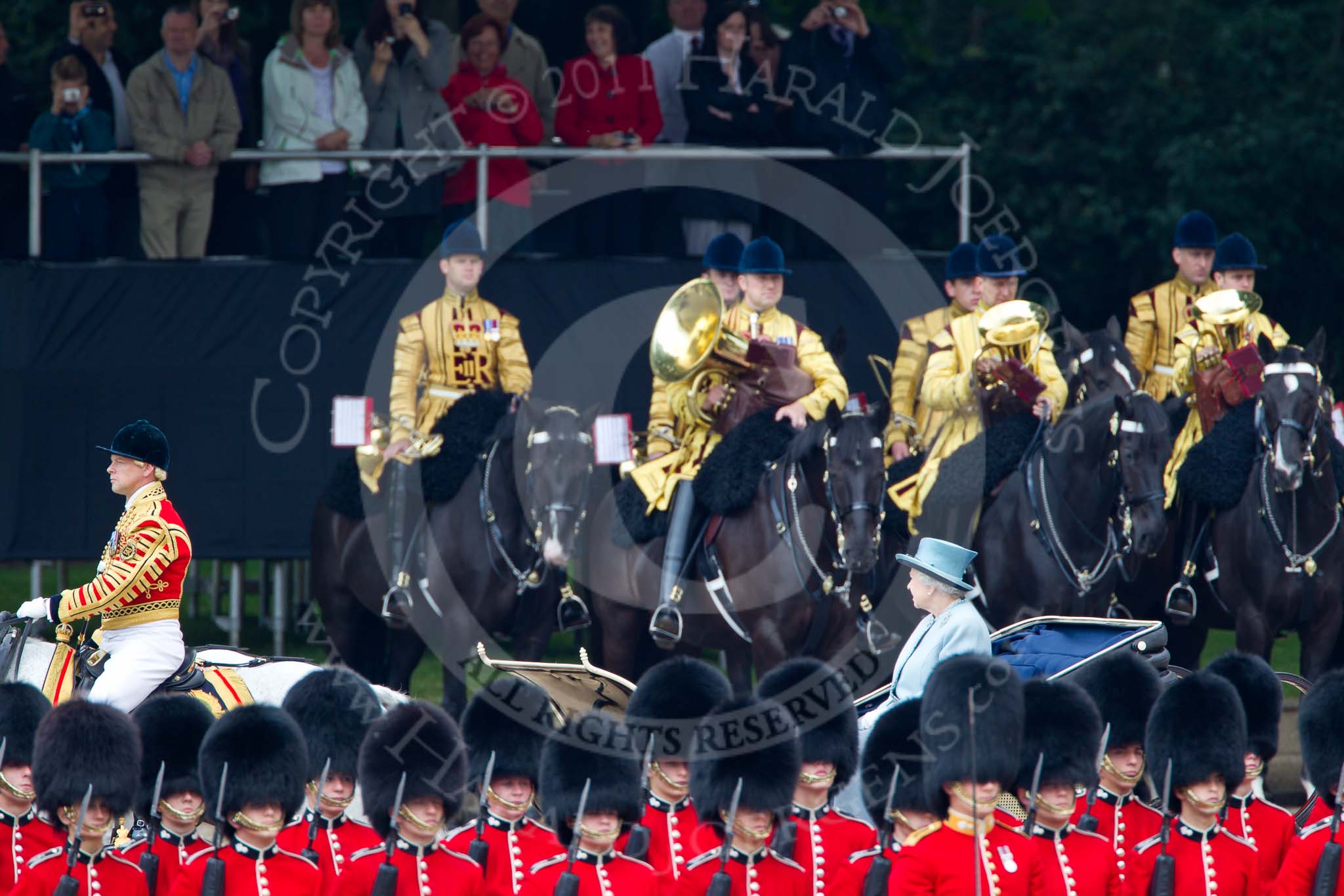 Trooping the Colour 2011: HM The Queen during the inspection of the troops. In charge of the ivory mounted phaeton Jack Hargreaves, Head Coachman. In the front, No. 4 Guard, Nijmegen Company Grenadier Guards, and in the background the Mounted Bands of the Household Cavalry..
Horse Guards Parade, Westminster,
London SW1,
Greater London,
United Kingdom,
on 11 June 2011 at 11:05, image #164