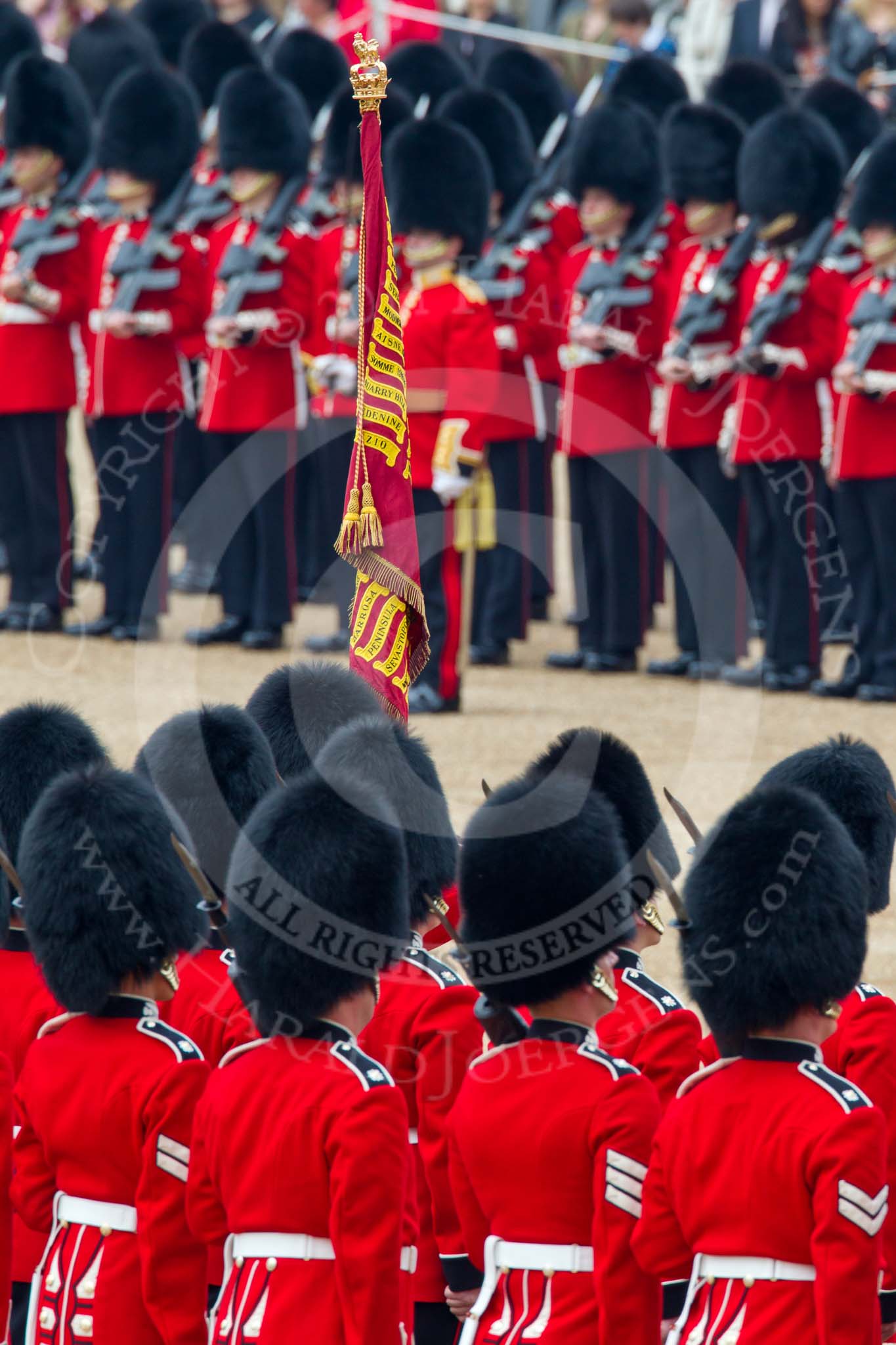 Trooping the Colour 2011: The Trooping of the Colour through the ranks is about to begin. The Ensign, carrying the Colour, is followed by No. 1 Guard, 1st Battalion Scots Guards, the Escort to the Colour..
Horse Guards Parade, Westminster,
London SW1,
Greater London,
United Kingdom,
on 11 June 2011 at 11:22, image #204