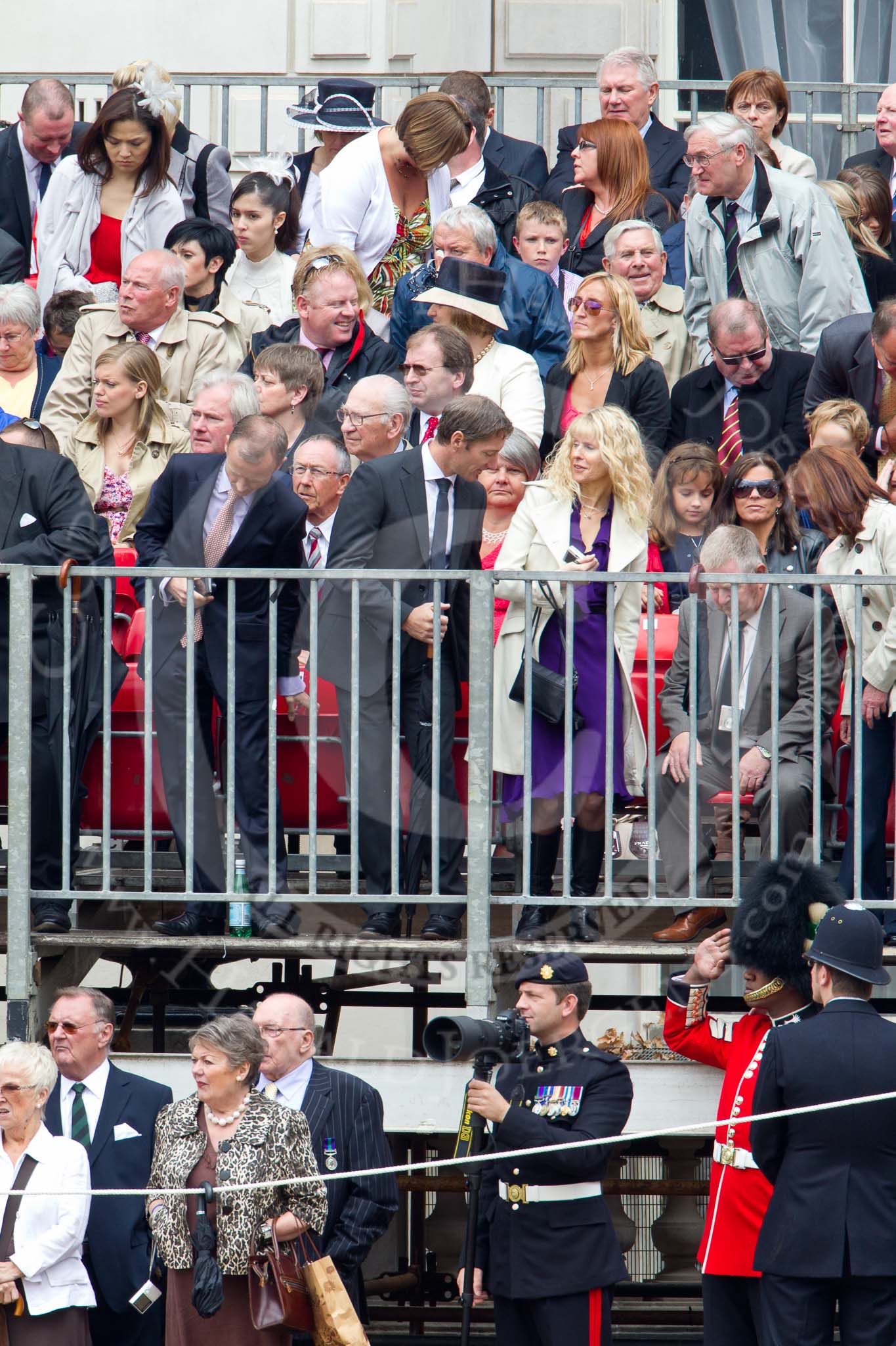 Photo 110611_112455_1D4_3987HaraldJoergens_ Trooping the Colour 2011: Specators dressed up for the occasion, an army photographer, a saluting guardsman from the Welsh Guards, and the Metropolitan Police..
Horse Guards Parade, Westminster,
London SW1,
Greater London,
United Kingdom,
on 11 June 2011 at 11:24, image #208