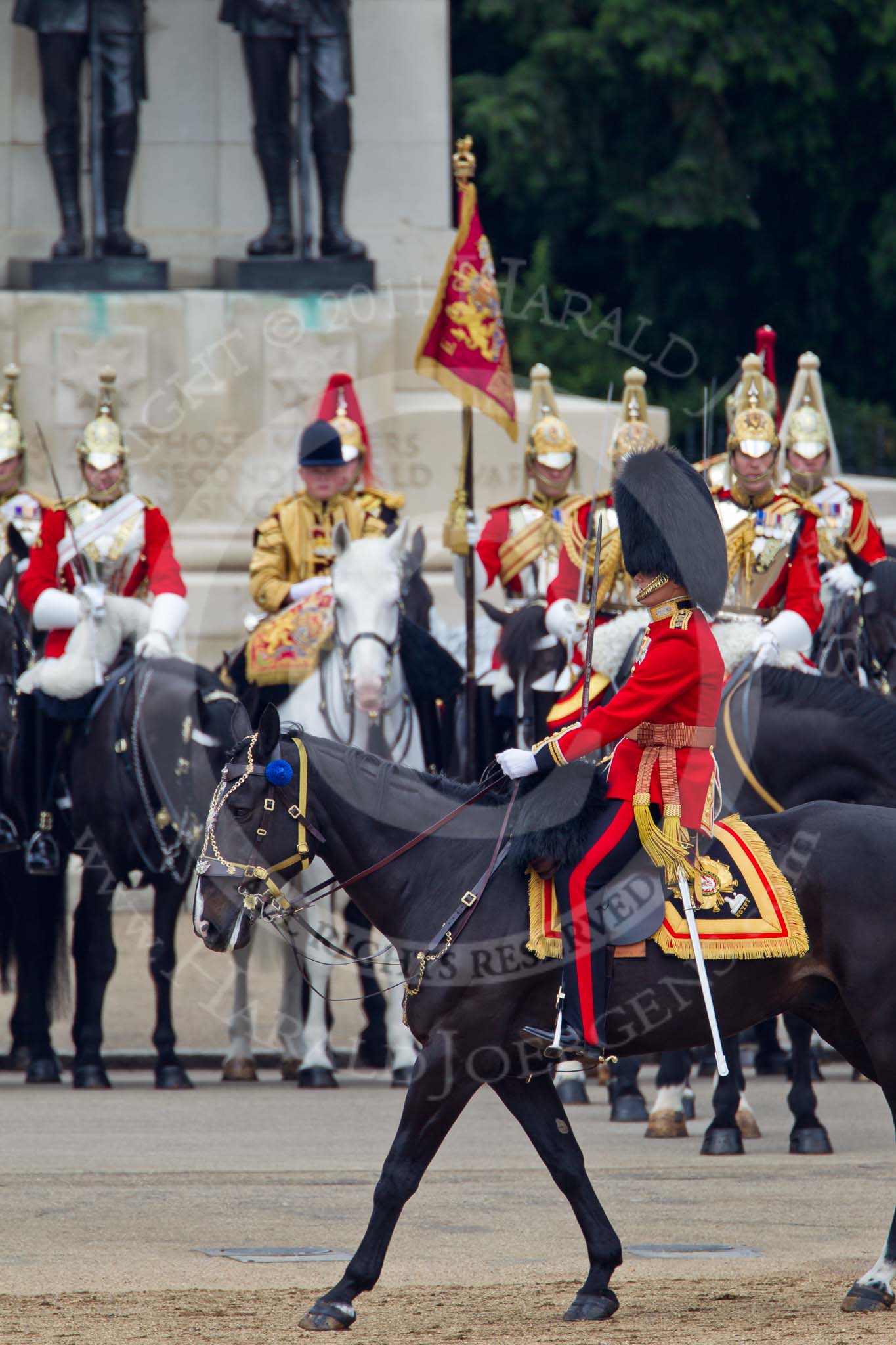 Trooping the Colour 2011: The Adjutant of the Parade, Captain Hamish Barne, 1st Battalion Scots Guards, Adjutant of the 1st Battalion Scots Guards, during the March Past. Behind, in front of the Guards Memorial, the Trumpeter and the Standard Bearer in the centre of The Life Guards..
Horse Guards Parade, Westminster,
London SW1,
Greater London,
United Kingdom,
on 11 June 2011 at 11:44, image #287