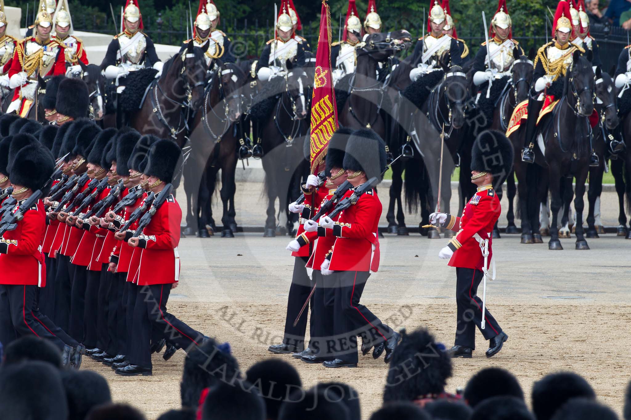 Photo 110611_115010_1D4_4642HaraldJoergens_ Trooping the Colour 2011: The Escort to the Colour, 1st Battalion Scots Guards, during the March Past in slow time. Carrying the Colour the Ensign, Tom Ogilvy, to his left Colour Sergeant Chris Millin. In the background the Household Cavalry, here the Blues and Royals..
Horse Guards Parade, Westminster,
London SW1,
Greater London,
United Kingdom,
on 11 June 2011 at 11:50, image #302